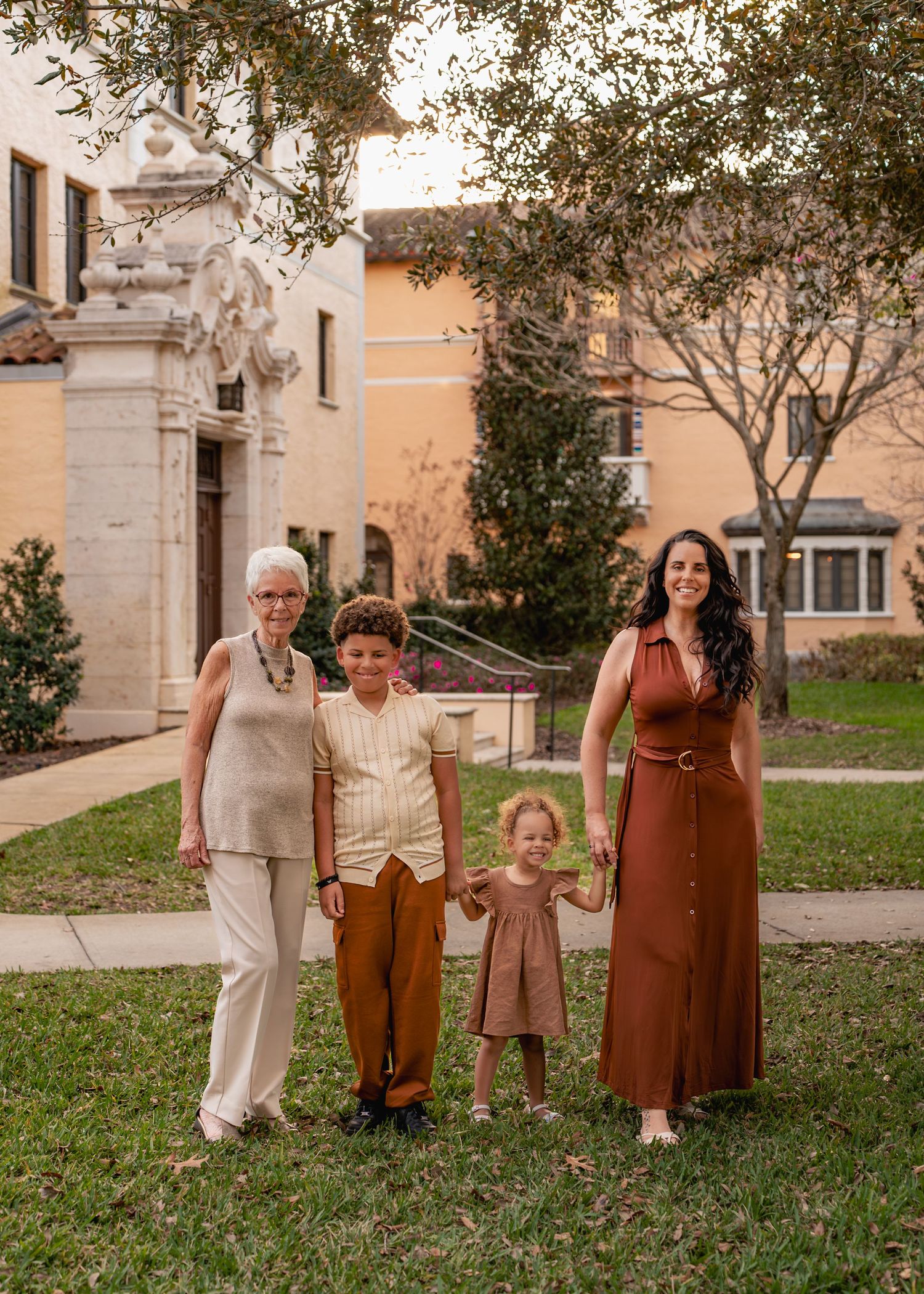 Outdoor family photography captured among the beautiful gardens and architecture of Rollins College in Winter Park Florida
