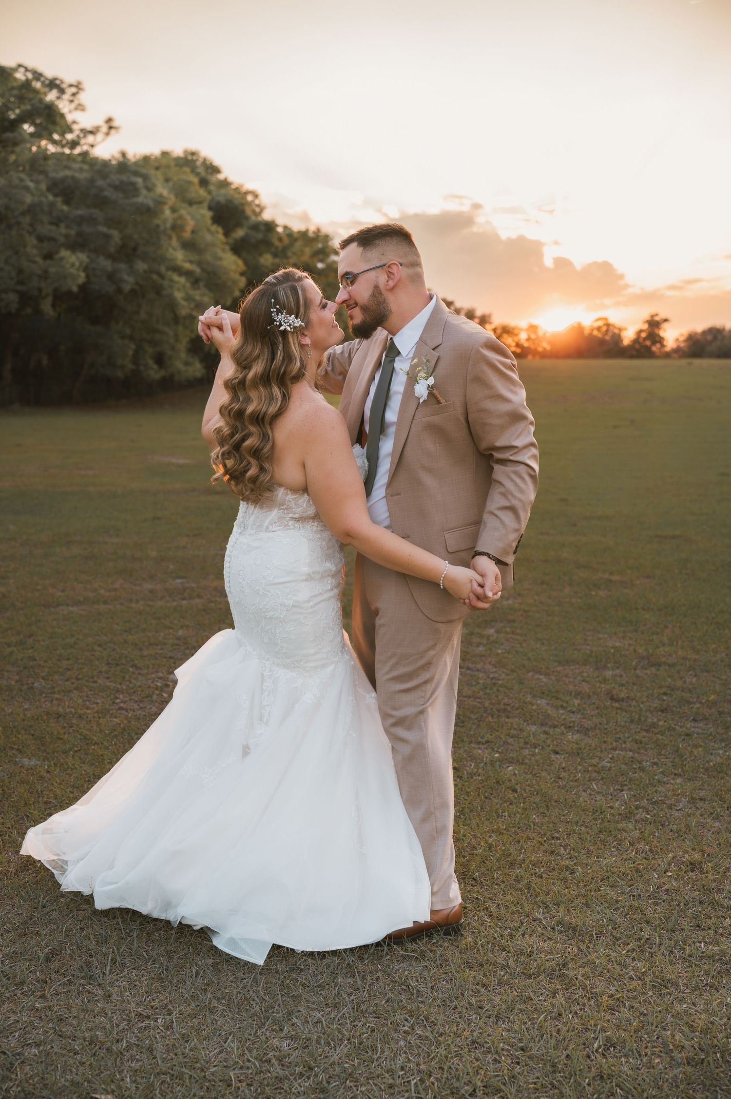 Romantic golden hour wedding portraits in the open field at Moss Estates wedding venue in Eustis, Florida.