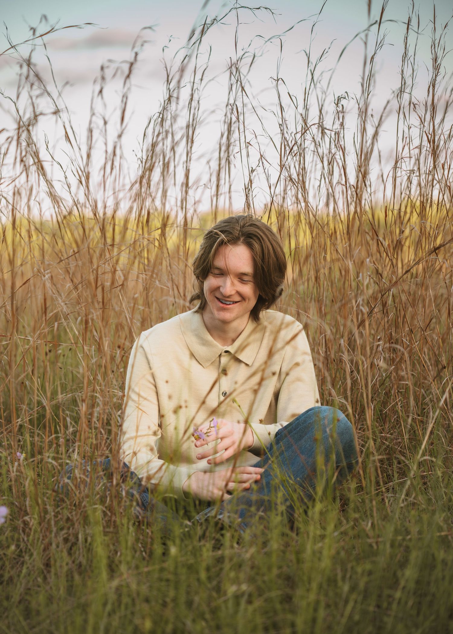 Golden hour graduation photography portraits captured in the open fields of Lake Runnymede Conservation Area St Cloud Florida
