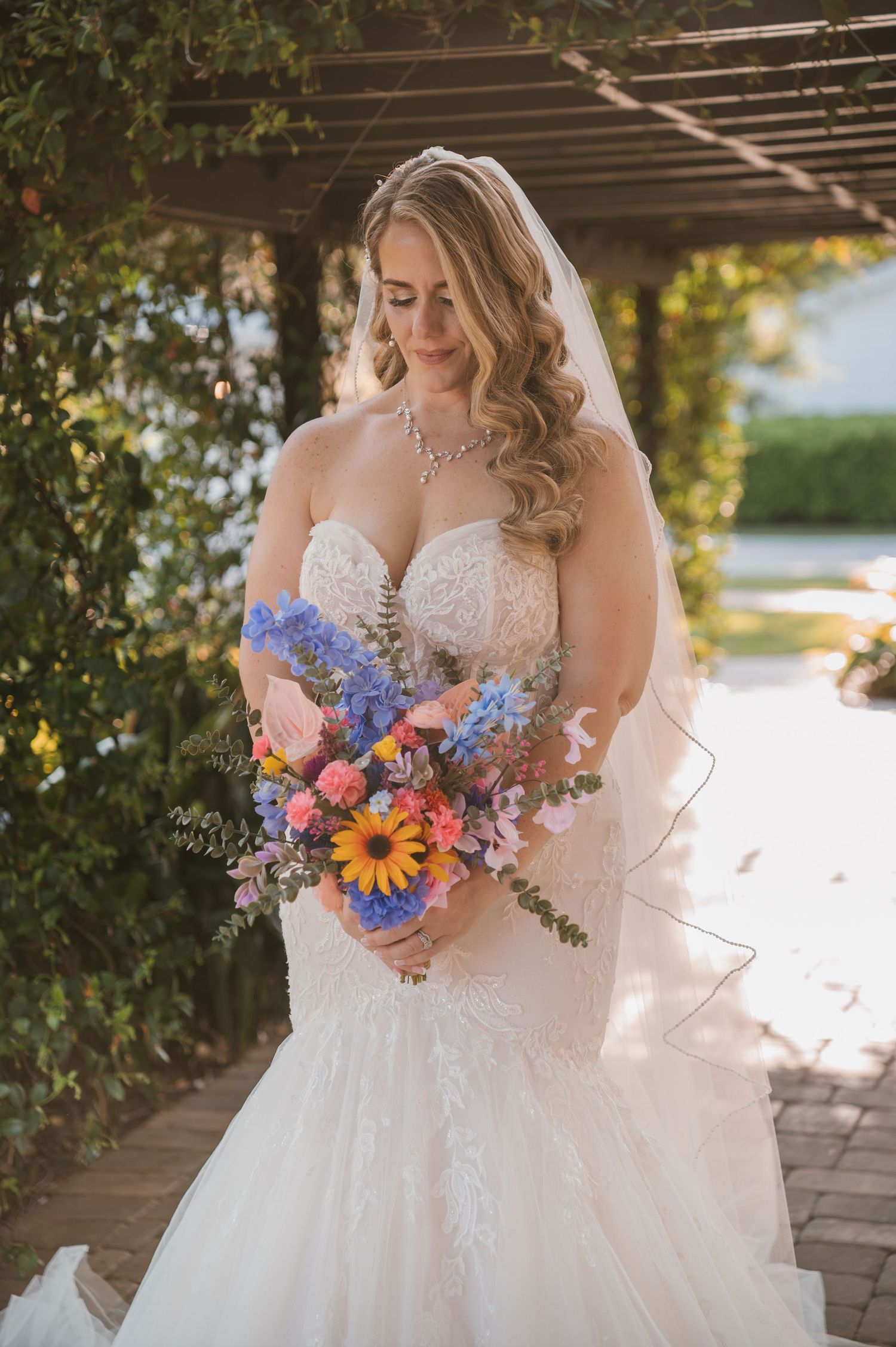 Elegant bridal portrait beneath the towering oak trees at Moss Estates wedding venue in Eustis, Florida.