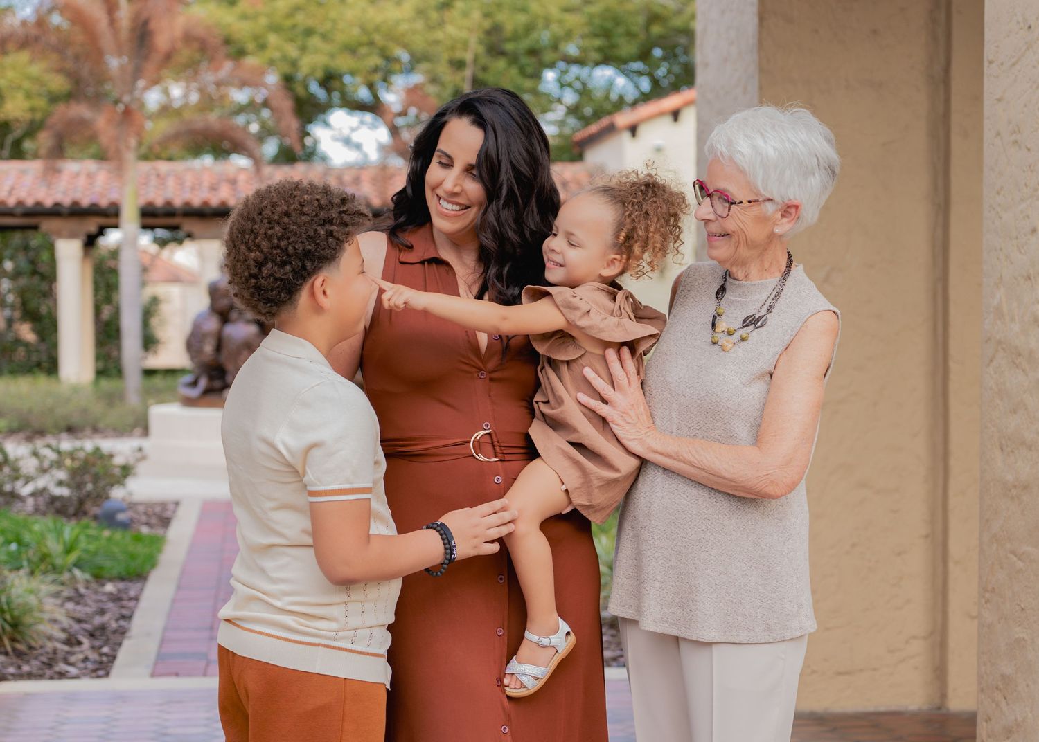 Outdoor family portraits surrounded by the beautiful architecture of Rollins College in Winter Park.