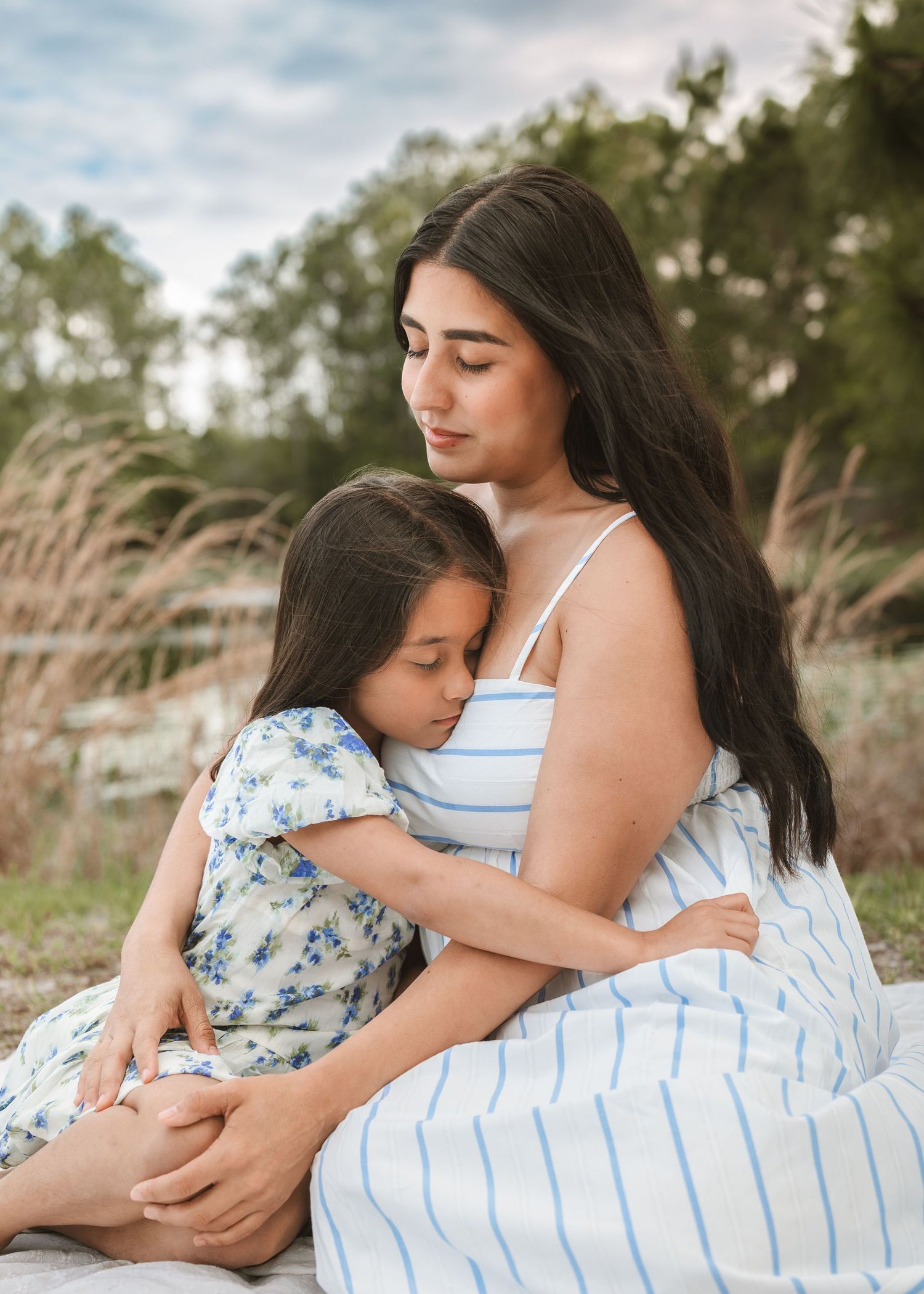 Outdoor boho motherhood photography portraits celebrating genuine family connection in St. Cloud Florida