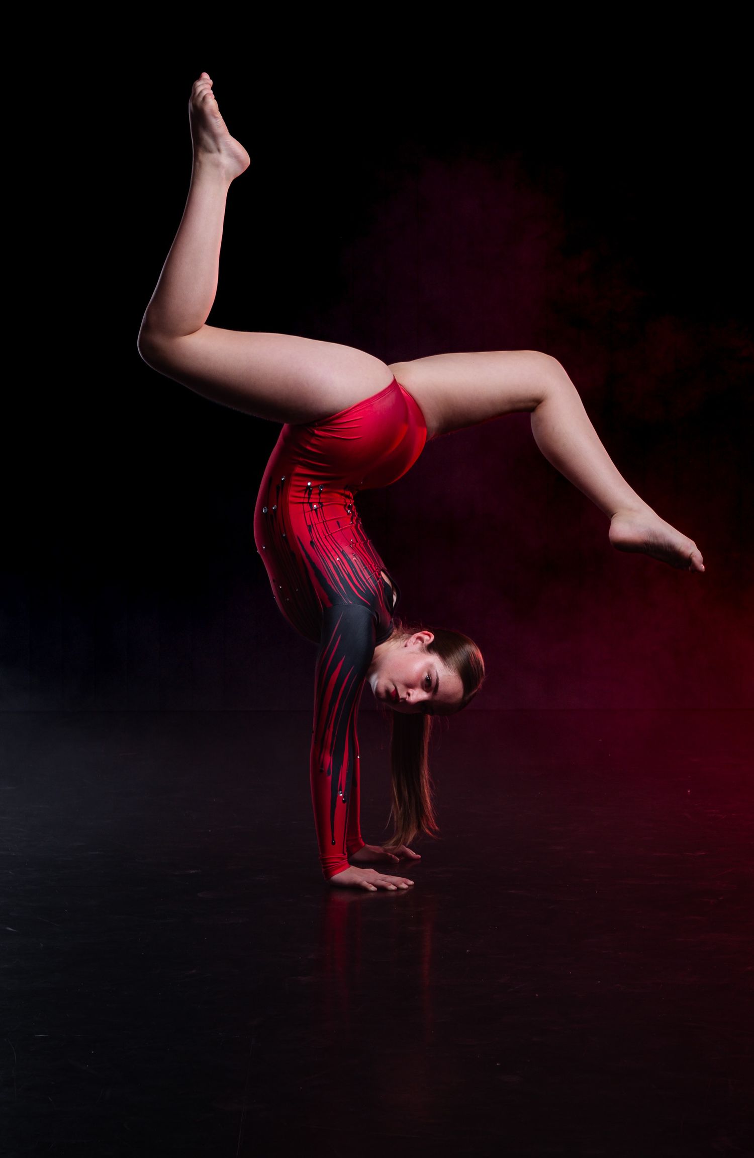 Technical dancer portrait captured with professional lighting to highlight correct turnout and disciplined posture by The Show Sports Media