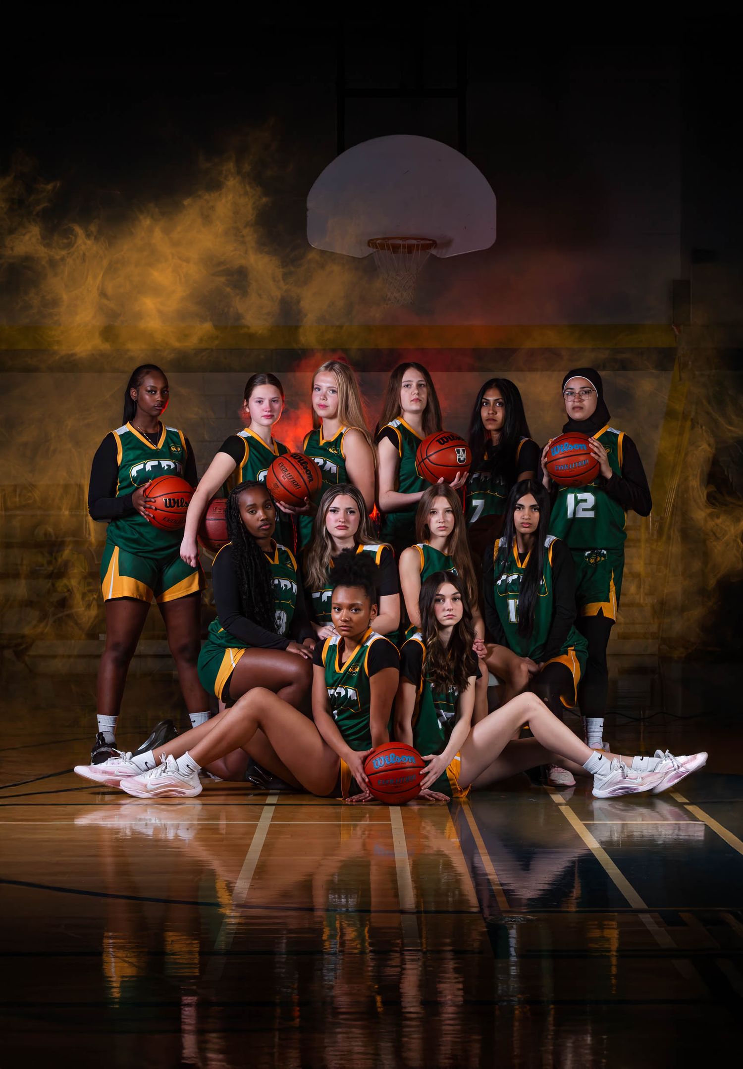 Ottawa team photography by The Show Sports Media featuring a  basketball team posing on a court with cinematic lighting and fog effects