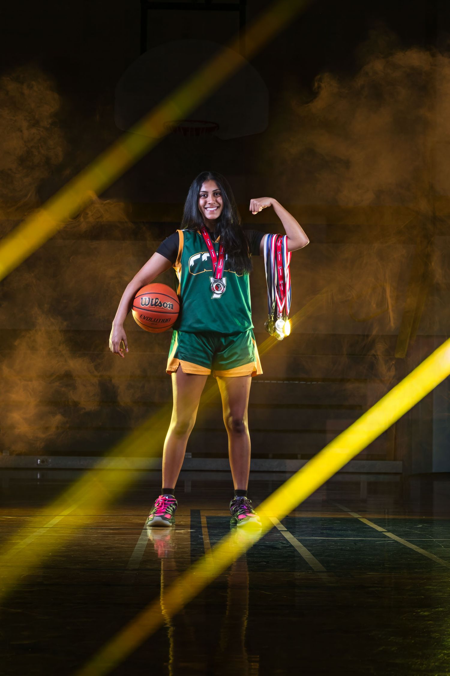 Cinematic basketball media day portrait featuring an Ottawa Wolverines player under bold gold lighting effects.