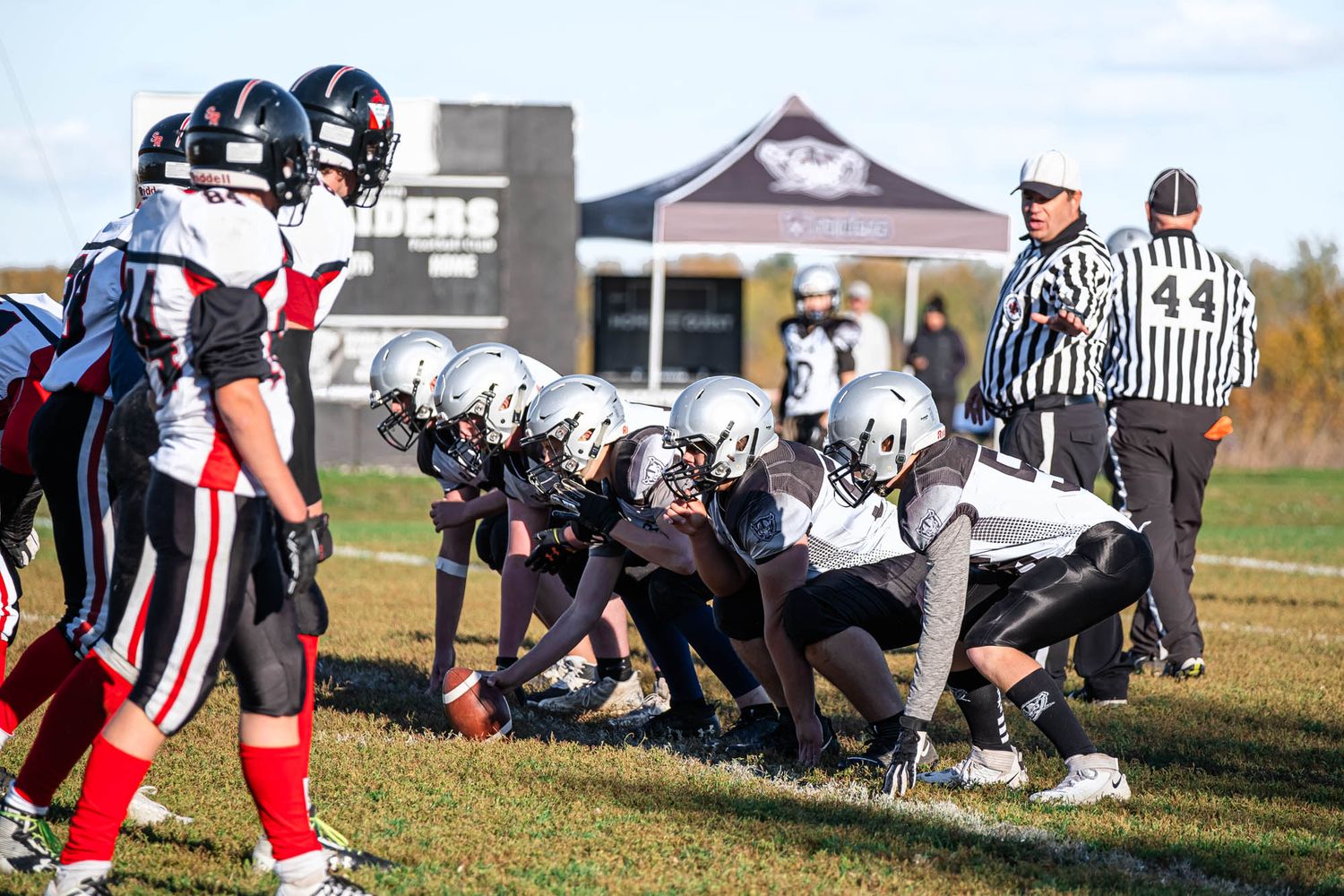 Ottawa youth football team lined up at the scrimmage line