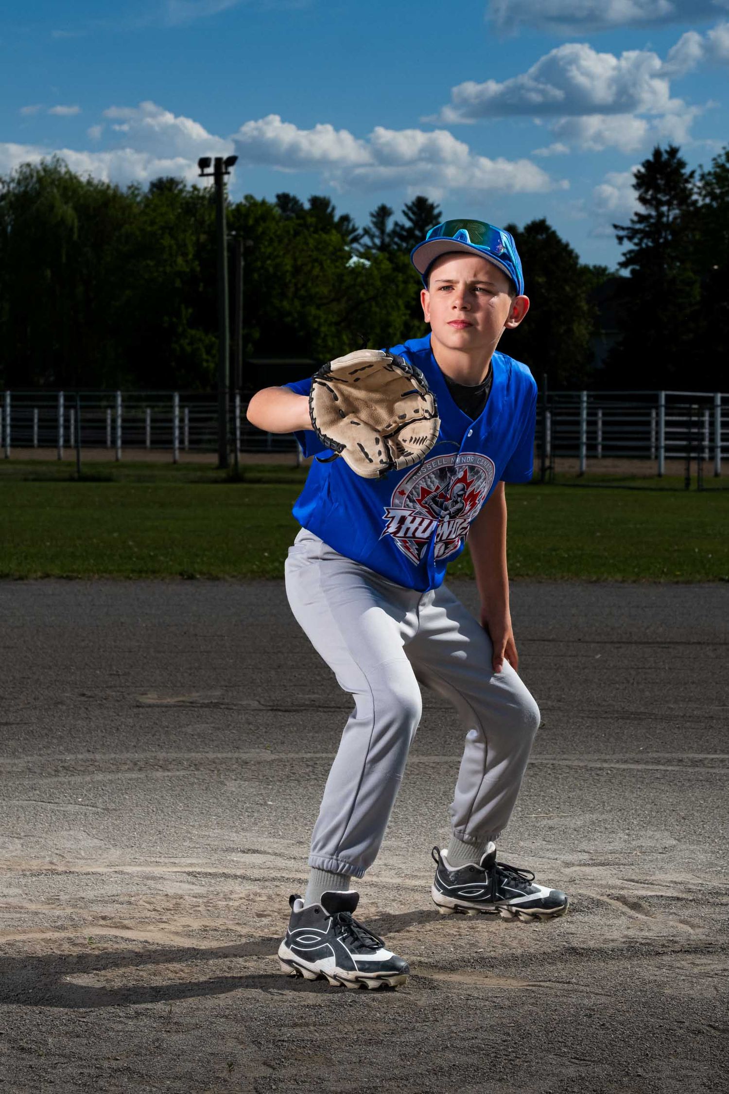 baseball player in a stance ready to catch the ball with his glove