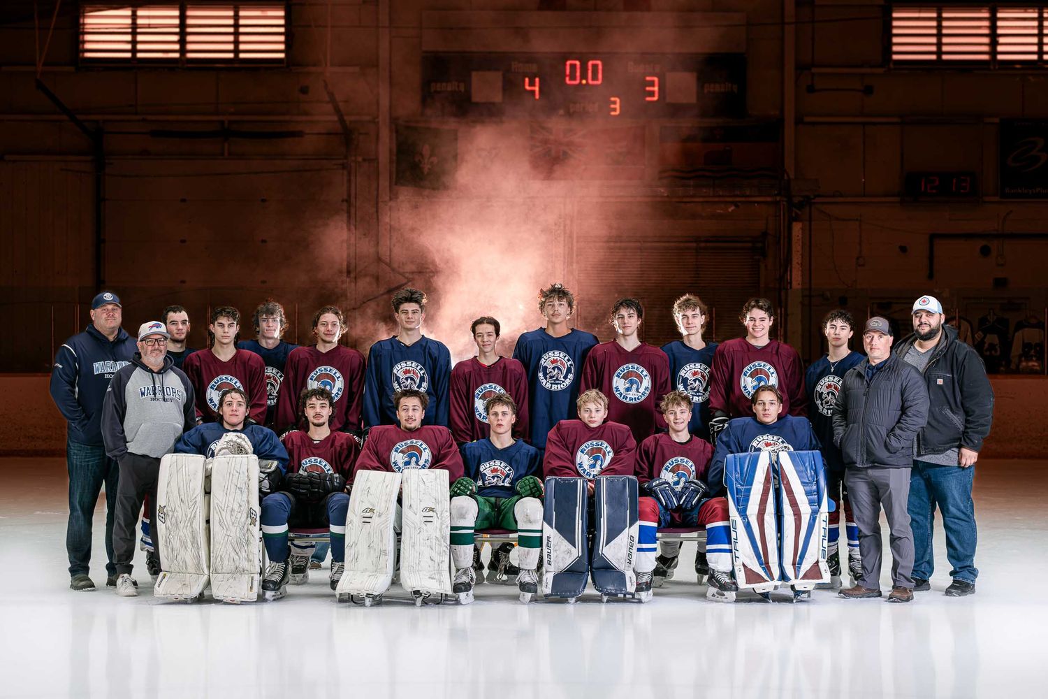 Elite on-ice hockey U18 Grad Game team portrait with professional studio lighting and atmospheric smoke effects in Eastern Ontario