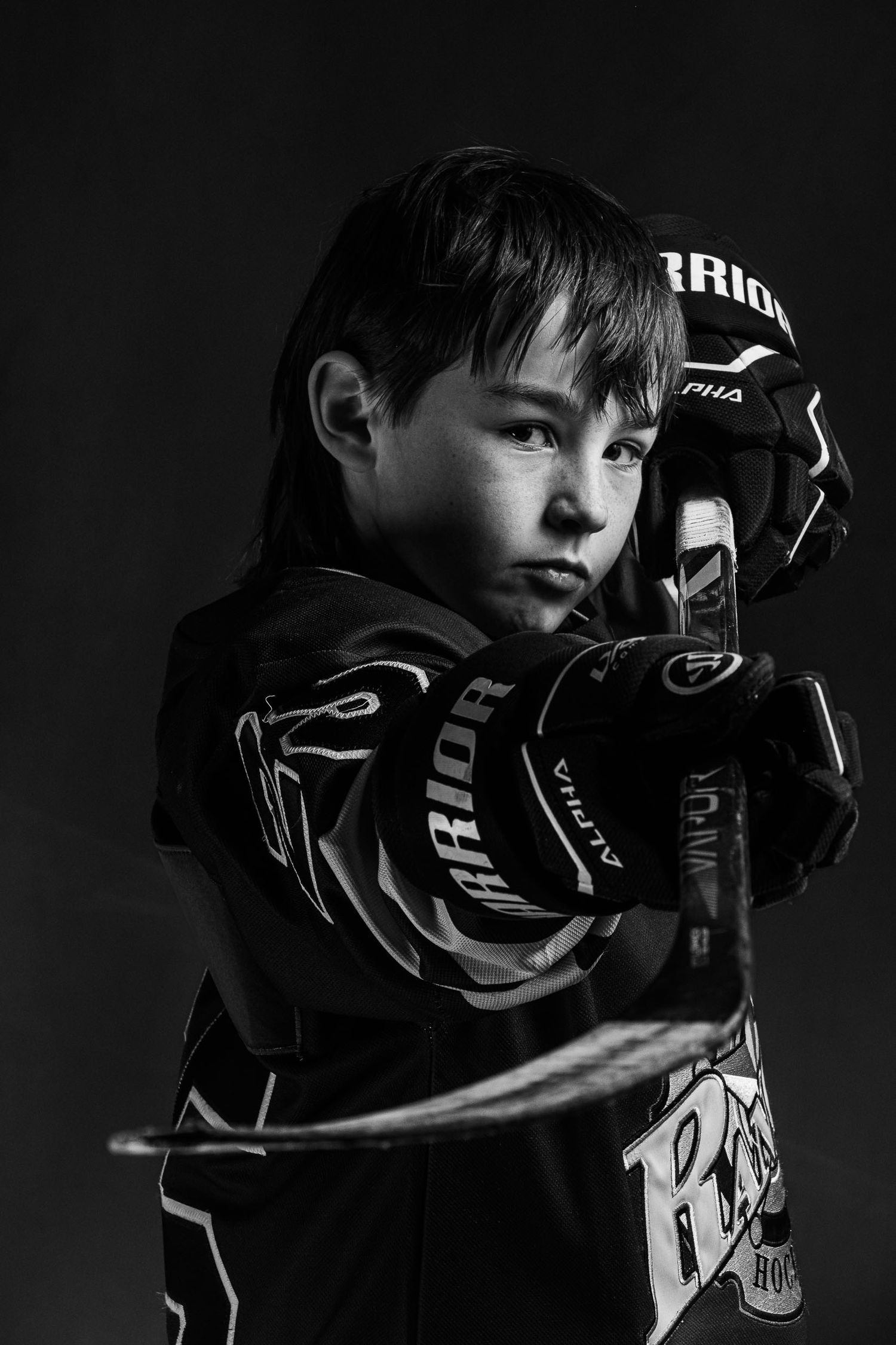 Black and white dramatic hockey U9 Castor Canucks individual portrait with professional studio lighting in Ottawa by The Show Sports Media