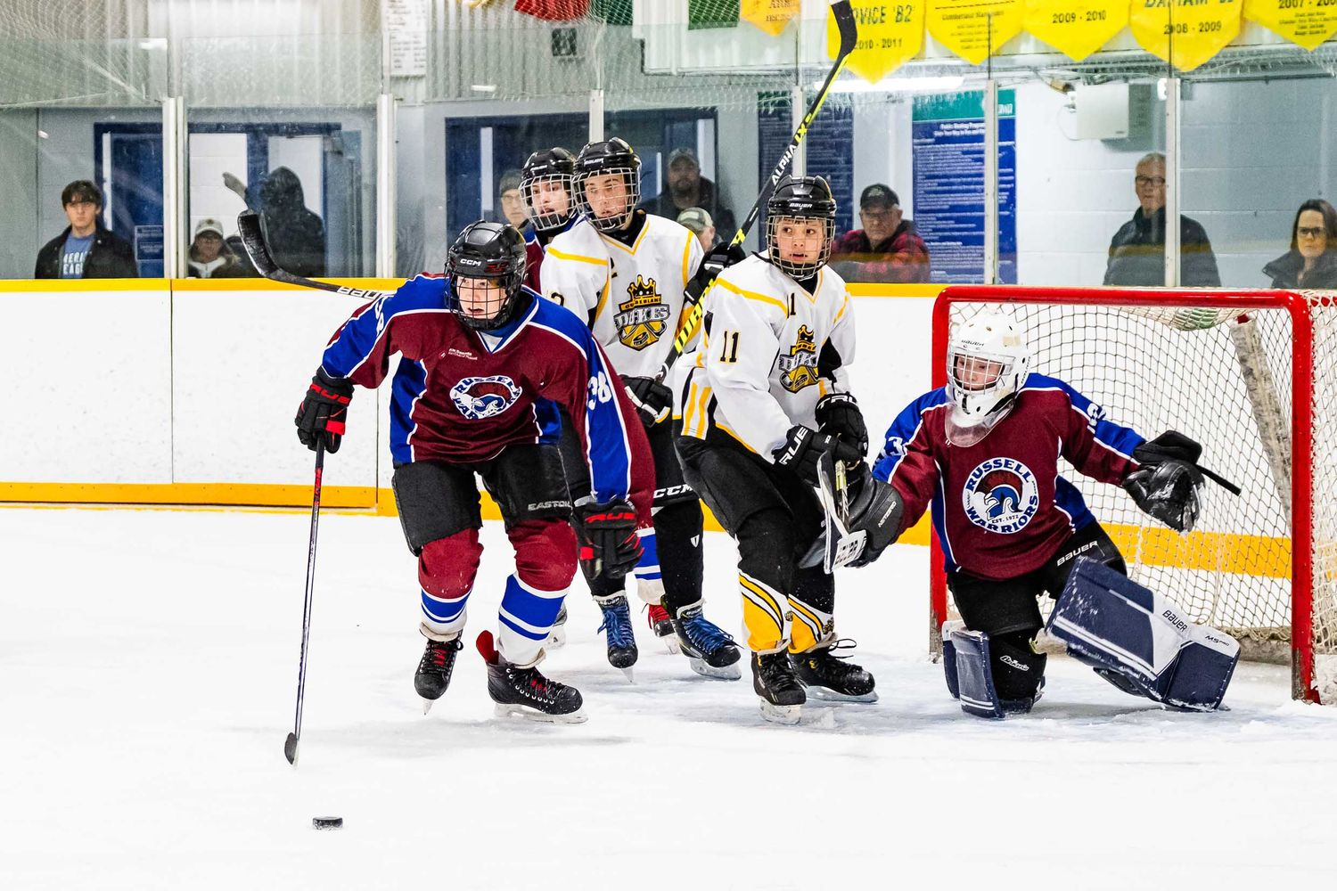 Elite hockey action photography by The Show Sports Media in Ottawa, featuring high-intensity play