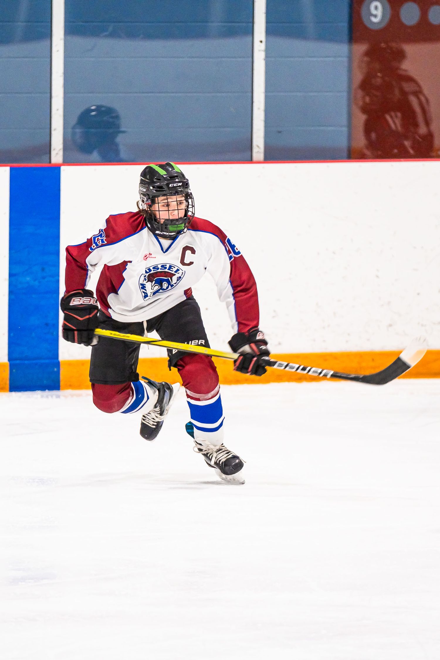 Professional hockey action portrait during a live Ottawa game, showcasing dynamic on-ice energy and elite sports media production quality