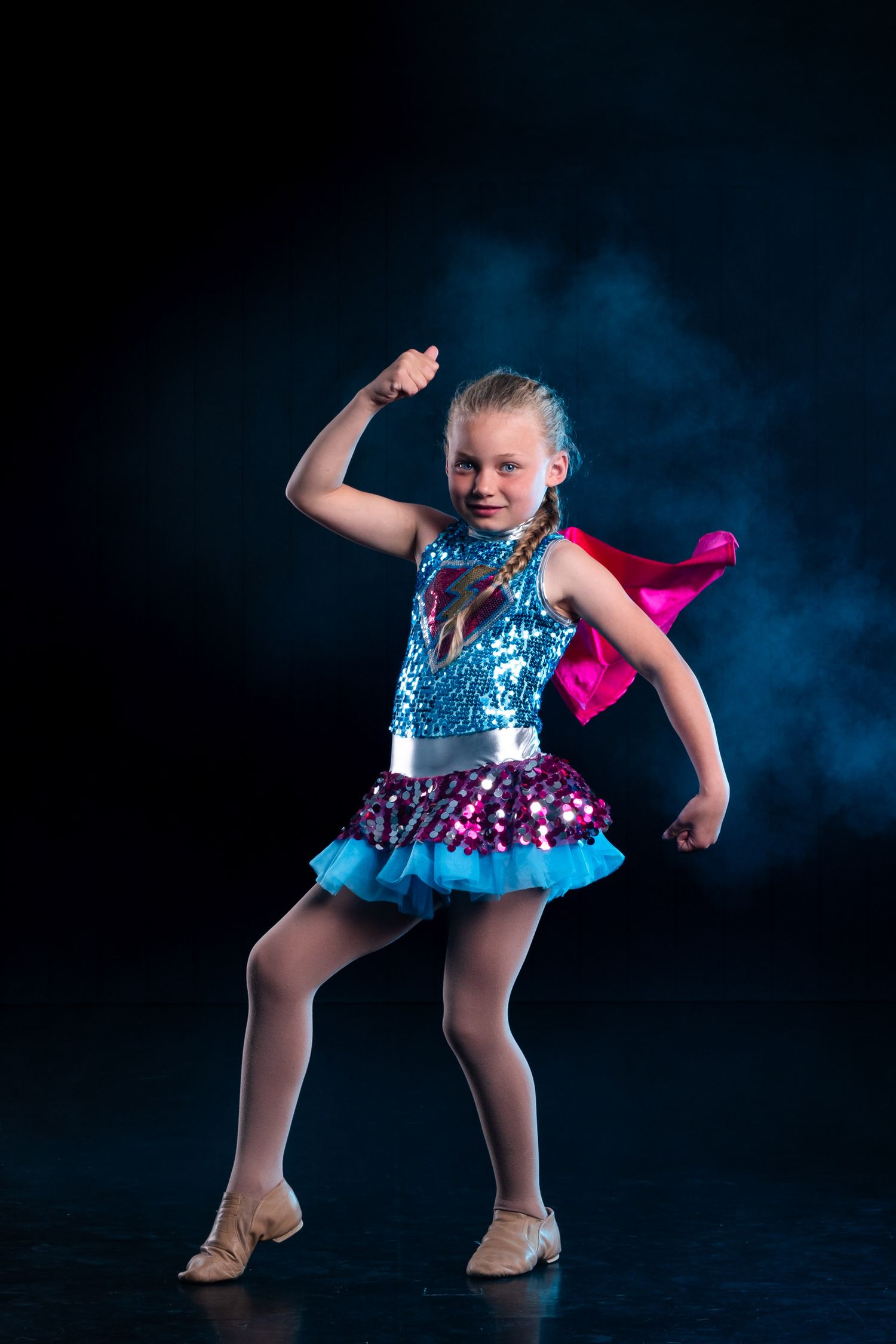 Cinematic dance studio portrait using dramatic studio lighting and effects to capture the dancer's artistic expression