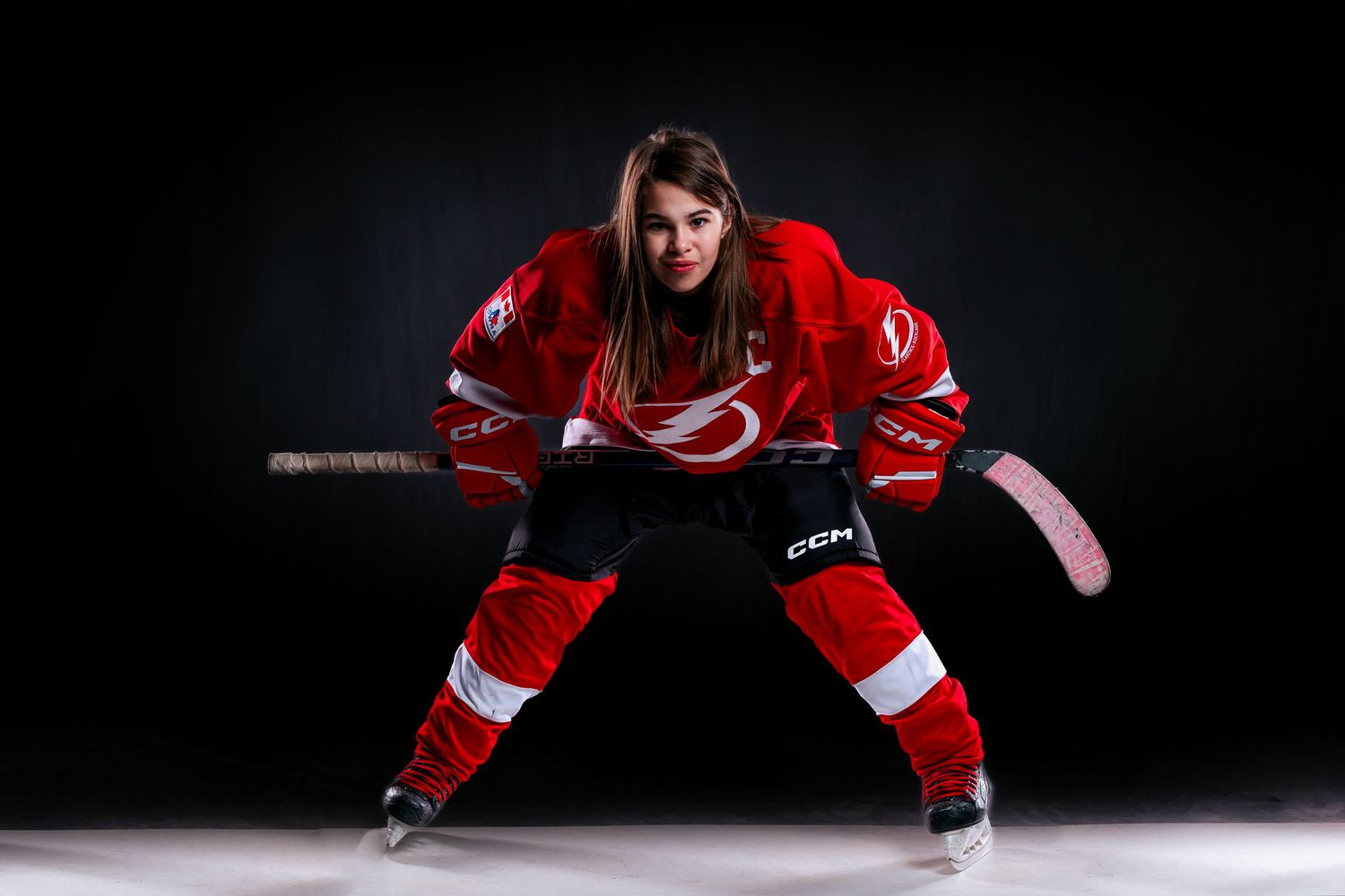 Hockey player portrait emphasizing  game-face intensity with professional studio lighting in Eastern Ontario by The Show Sports Media