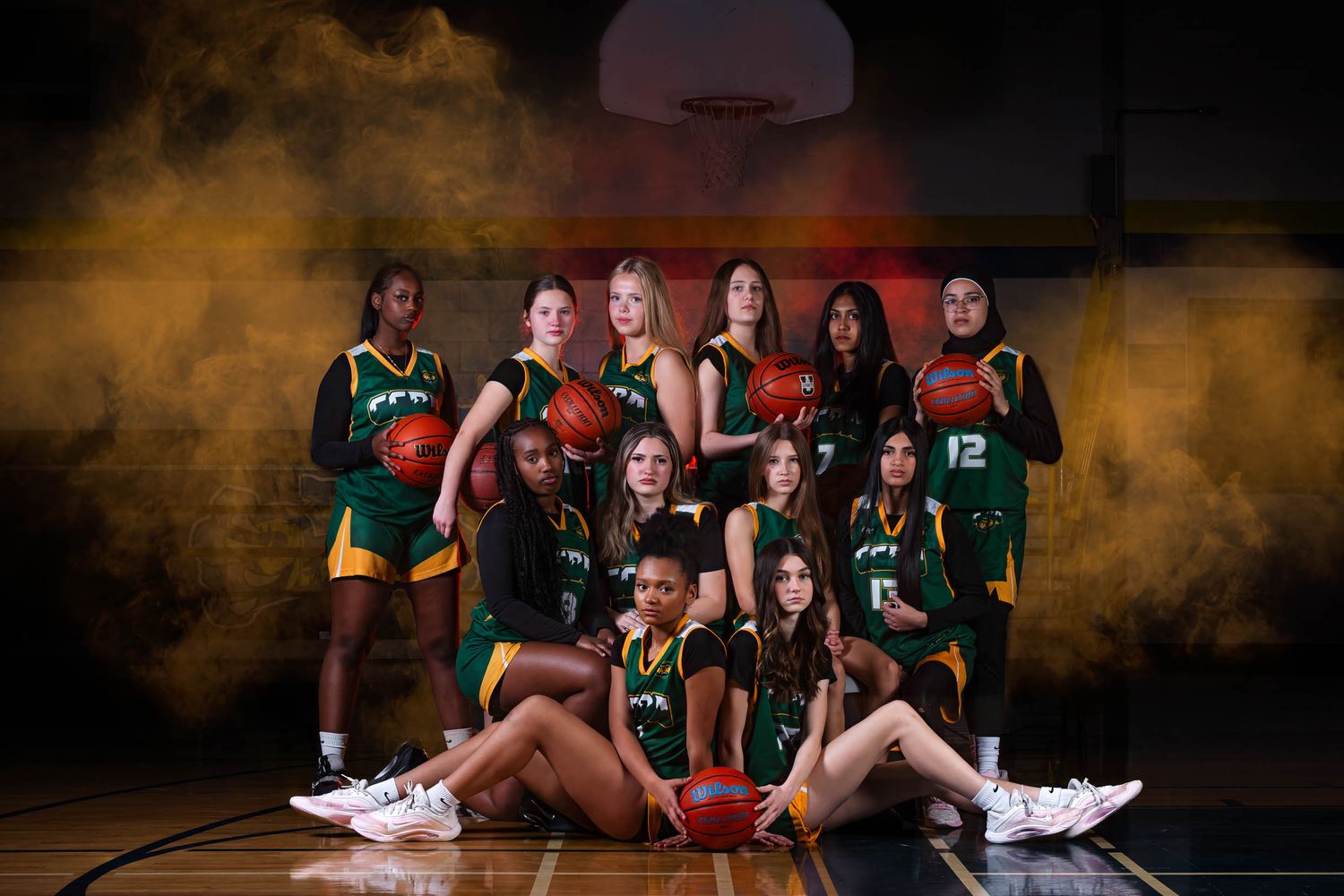 Ottawa team photography by The Show Sports Media featuring a  basketball team posing on a court with cinematic lighting and fog effects