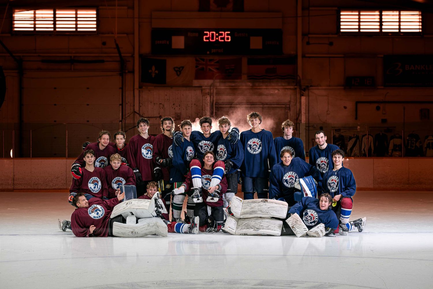 Cinematic on-ice hockey team U18 Grad Game portrait with professional studio lighting and atmospheric smoke effects by The Show Sports Media