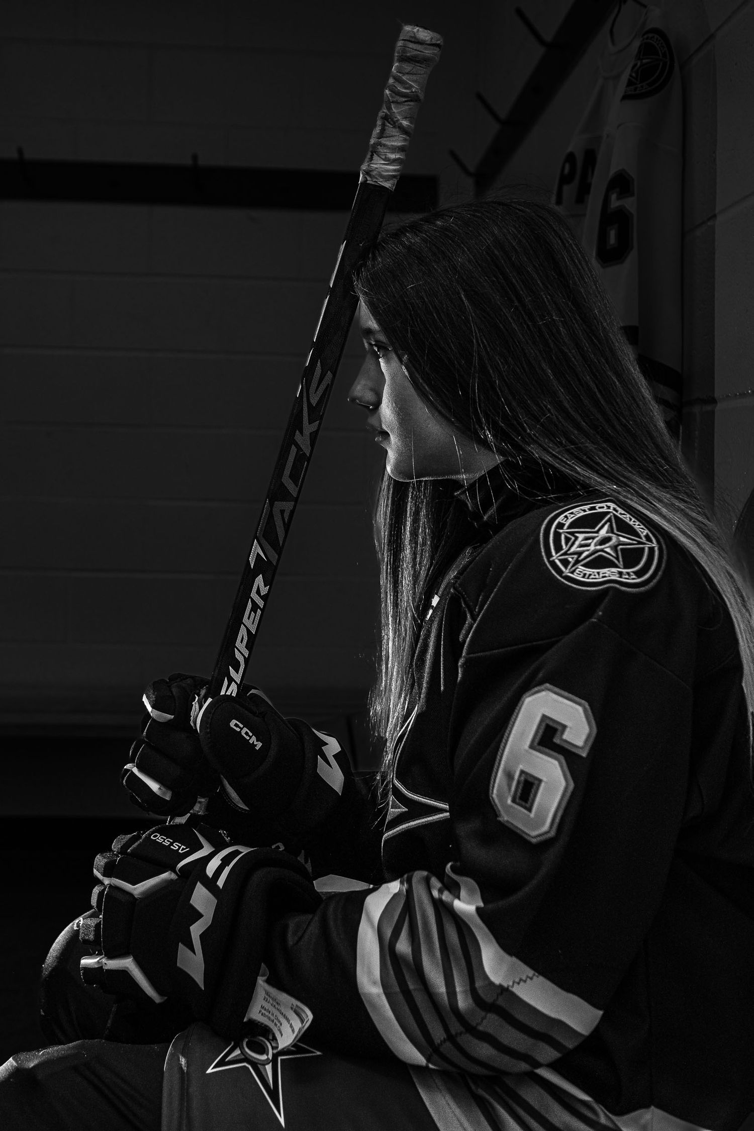 Dramatic black and white Stars U15 individual hockey portrait with professional studio lighting in Ottawa