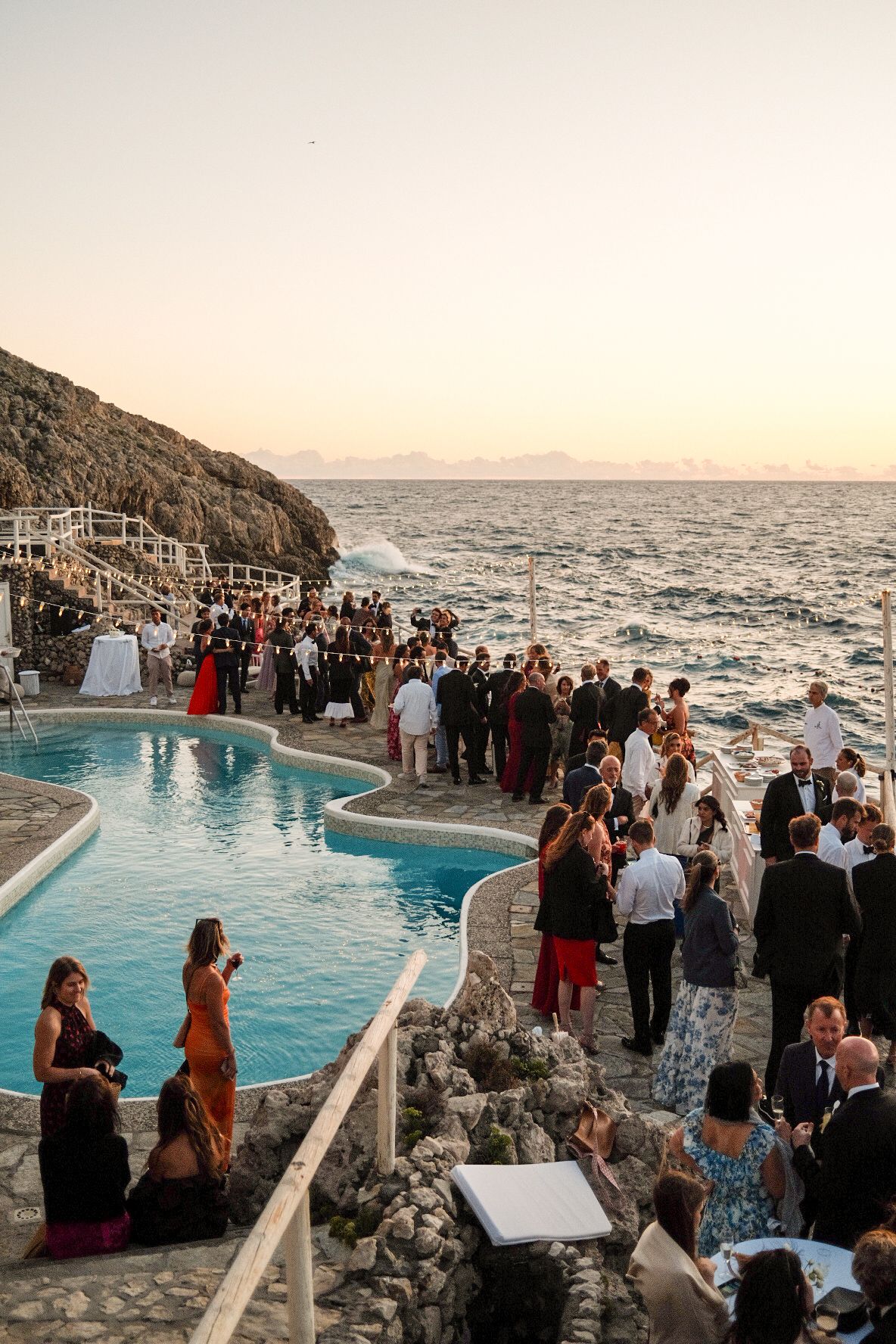 Elegant wedding drinks reception overlooking Capri coastline during an Italian destination wedding