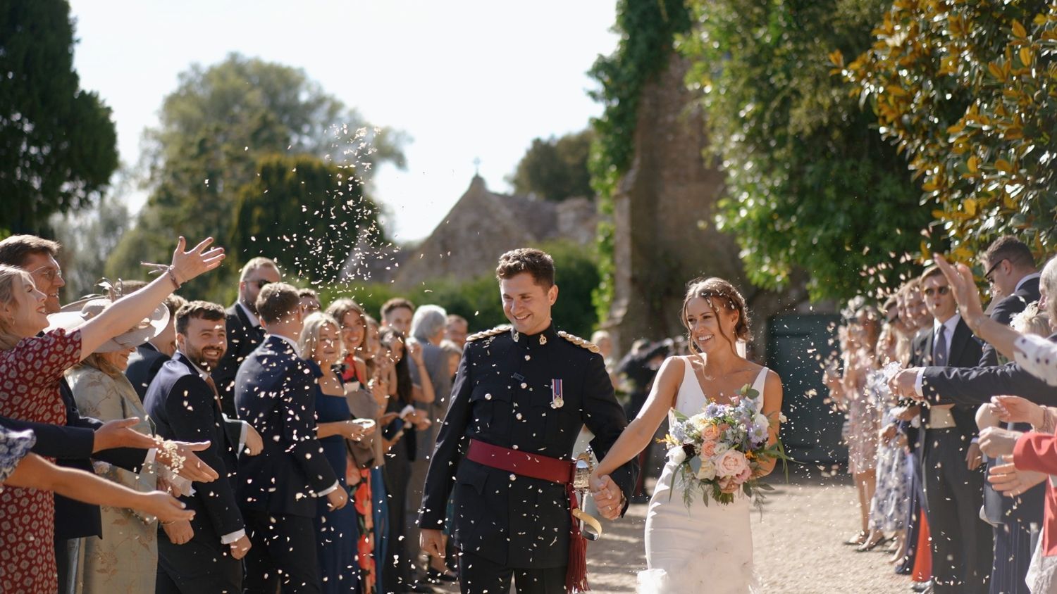 Couple celebrating confetti moment at Brympton House country house wedding Somerset