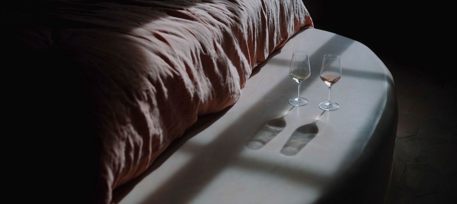 Two glasses of Rose catching the sunlight during morning bridal preperations