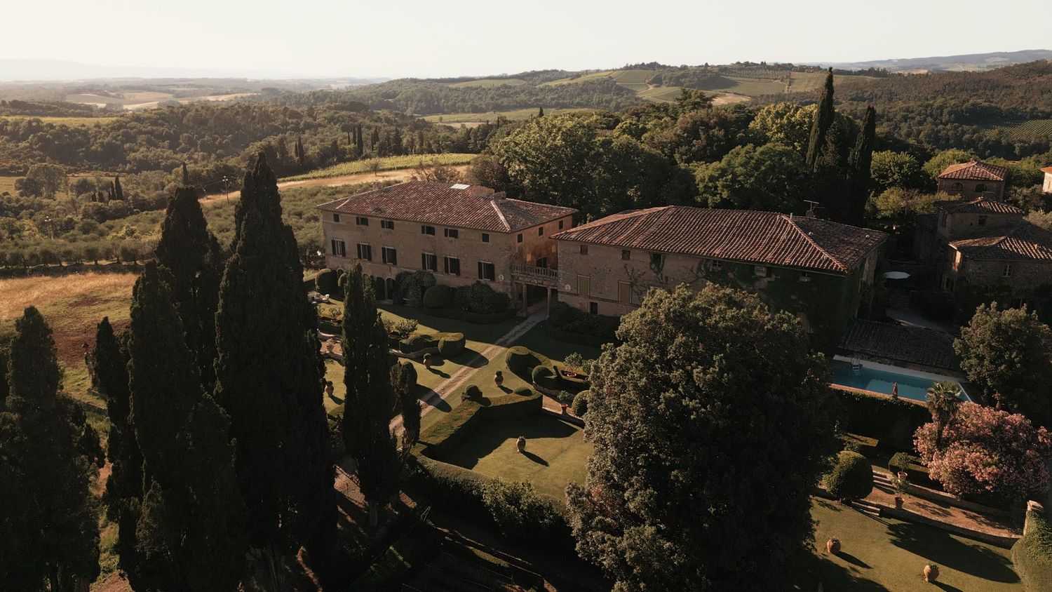 Aerial drone photo of Borgo Stomennano, luxury Tuscany wedding venue.