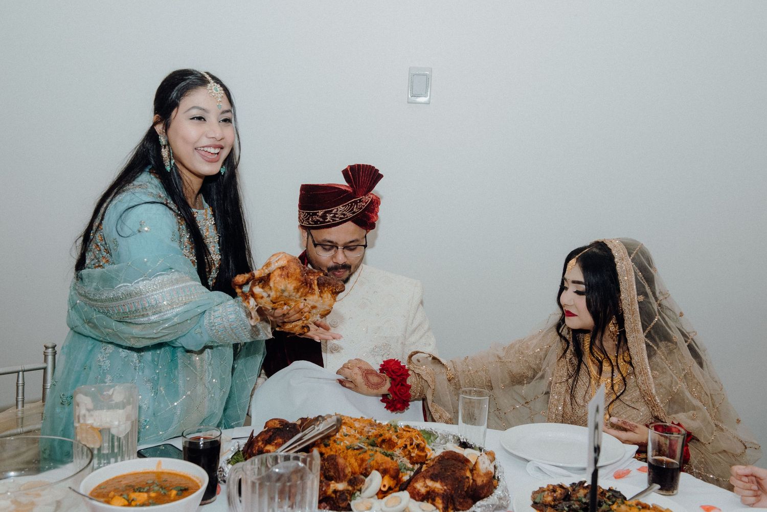 Celebratory meal being shared at a South Asian wedding reception.