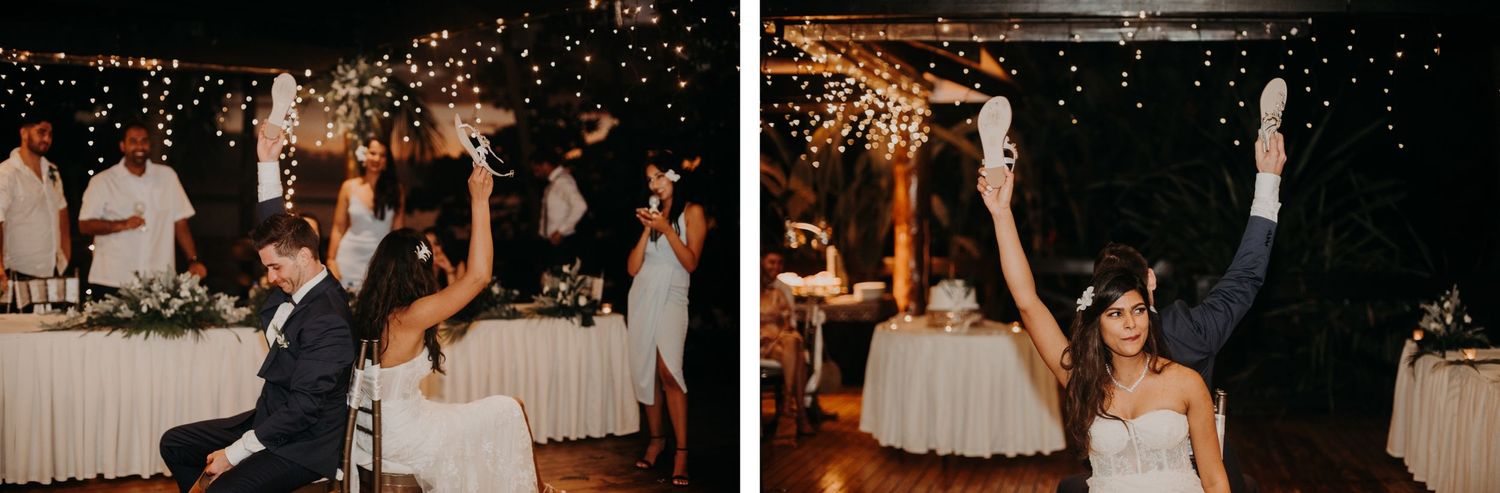 Celebratory moments during wedding reception with bride raising champagne glass.