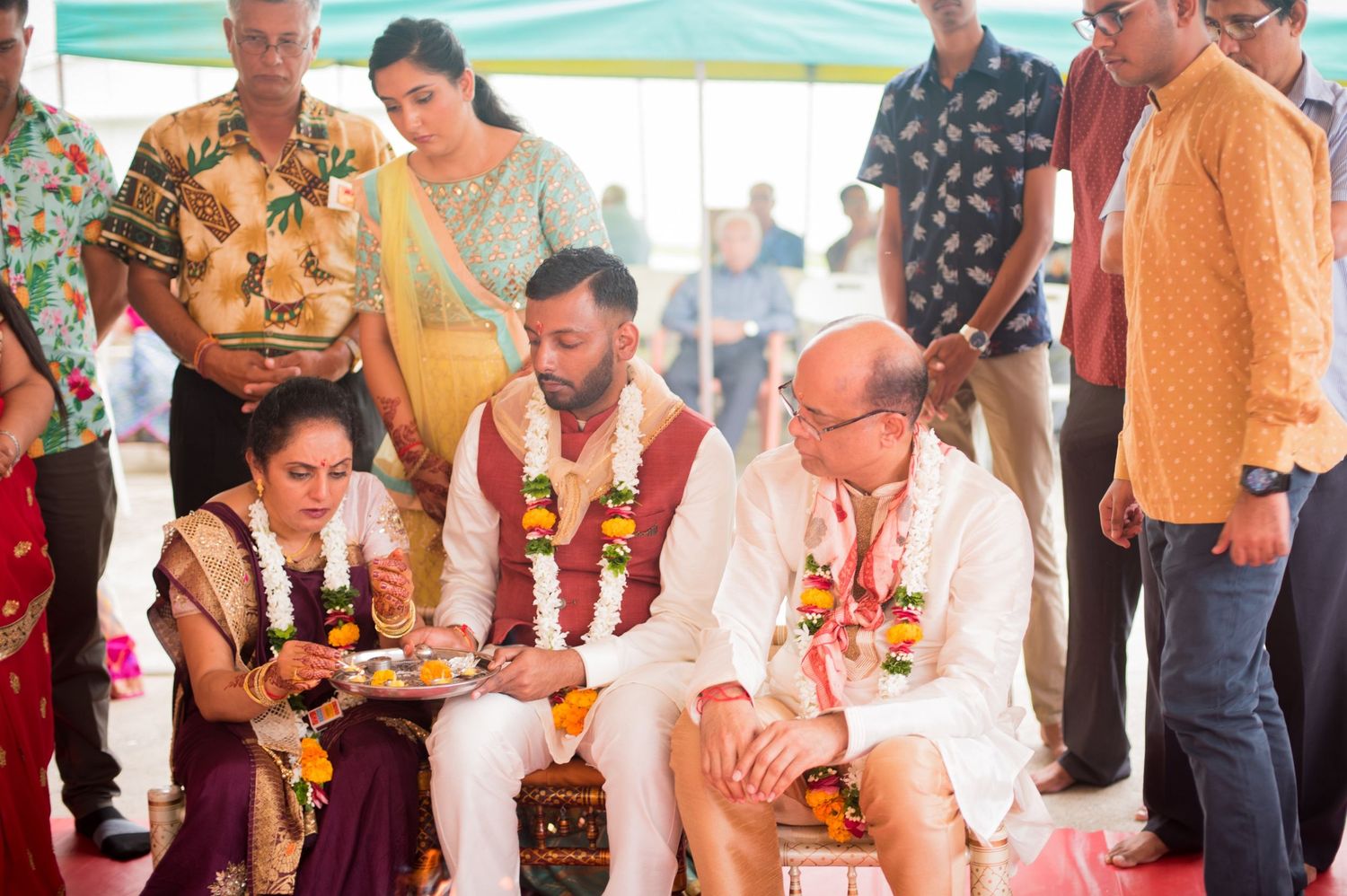 Traditional Hindu wedding ceremony with participants performing sacred rituals.
