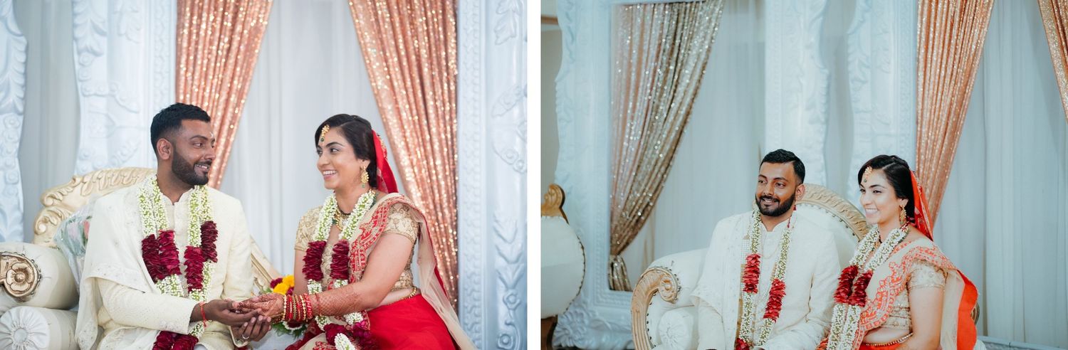 Wedding couple exchanges ceremonial items during traditional Indian ceremony.