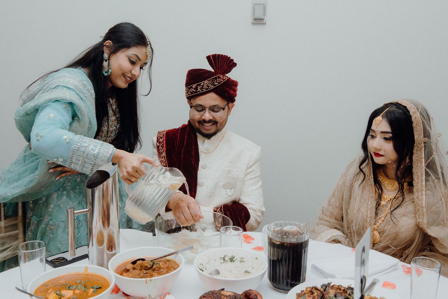 Traditional South Asian wedding meal being served at an intimate gathering.