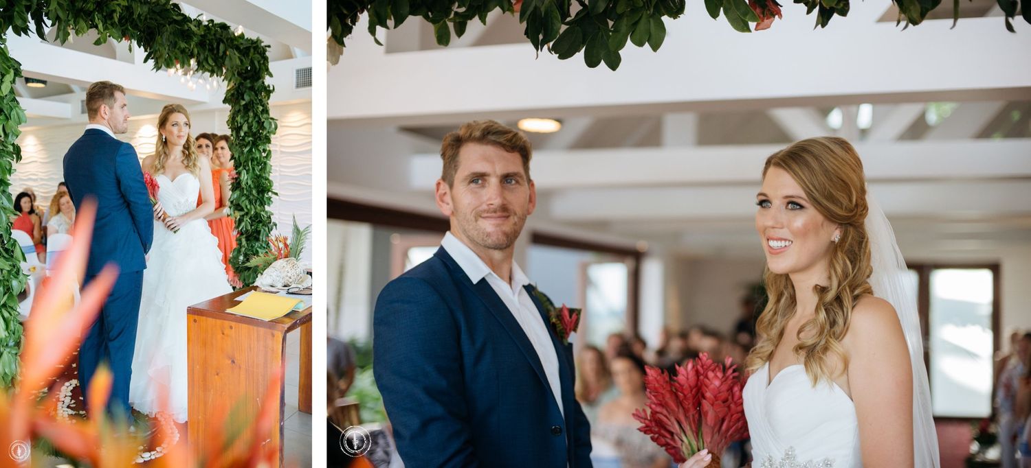 Beautiful wedding ceremony moments captured under a leafy green arch with red flowers.