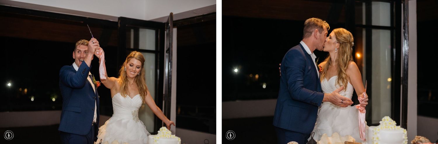 Newlywed couple shares emotional moments while cutting their wedding cake.