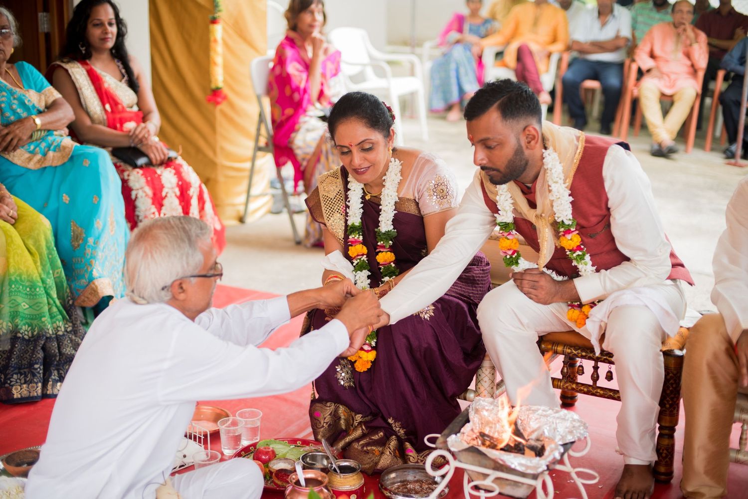 Traditional Hindu wedding ritual being performed with priests and family members.