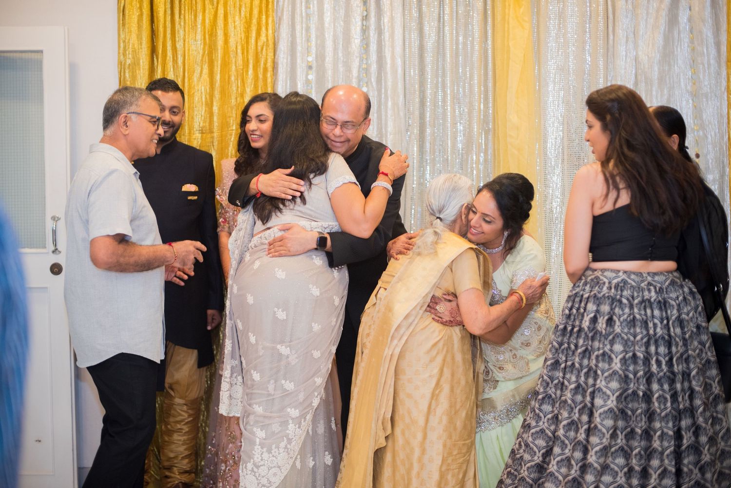 Candid moment of celebration at formal gathering with festive atmosphere.