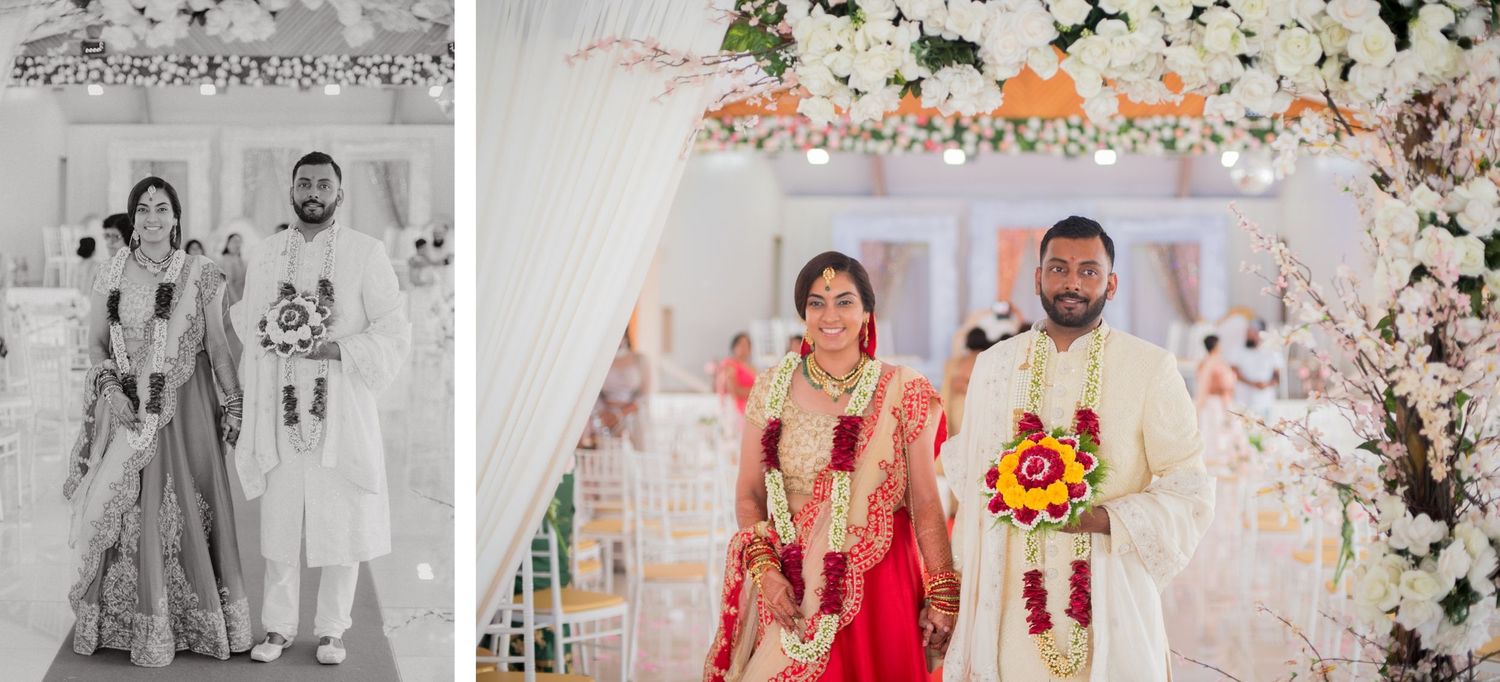 Wedding couple poses under floral arch in traditional Indian wedding attire, both black and white and color shown.