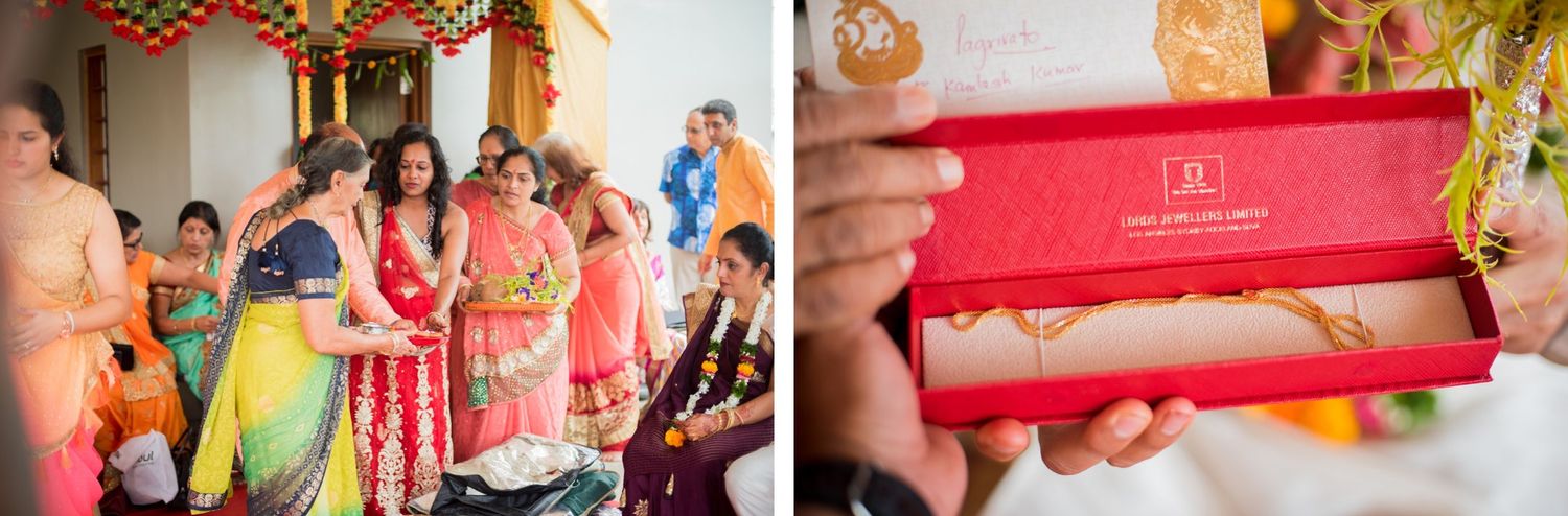 Close-up of a red decorative box being held during an Indian wedding ceremony.