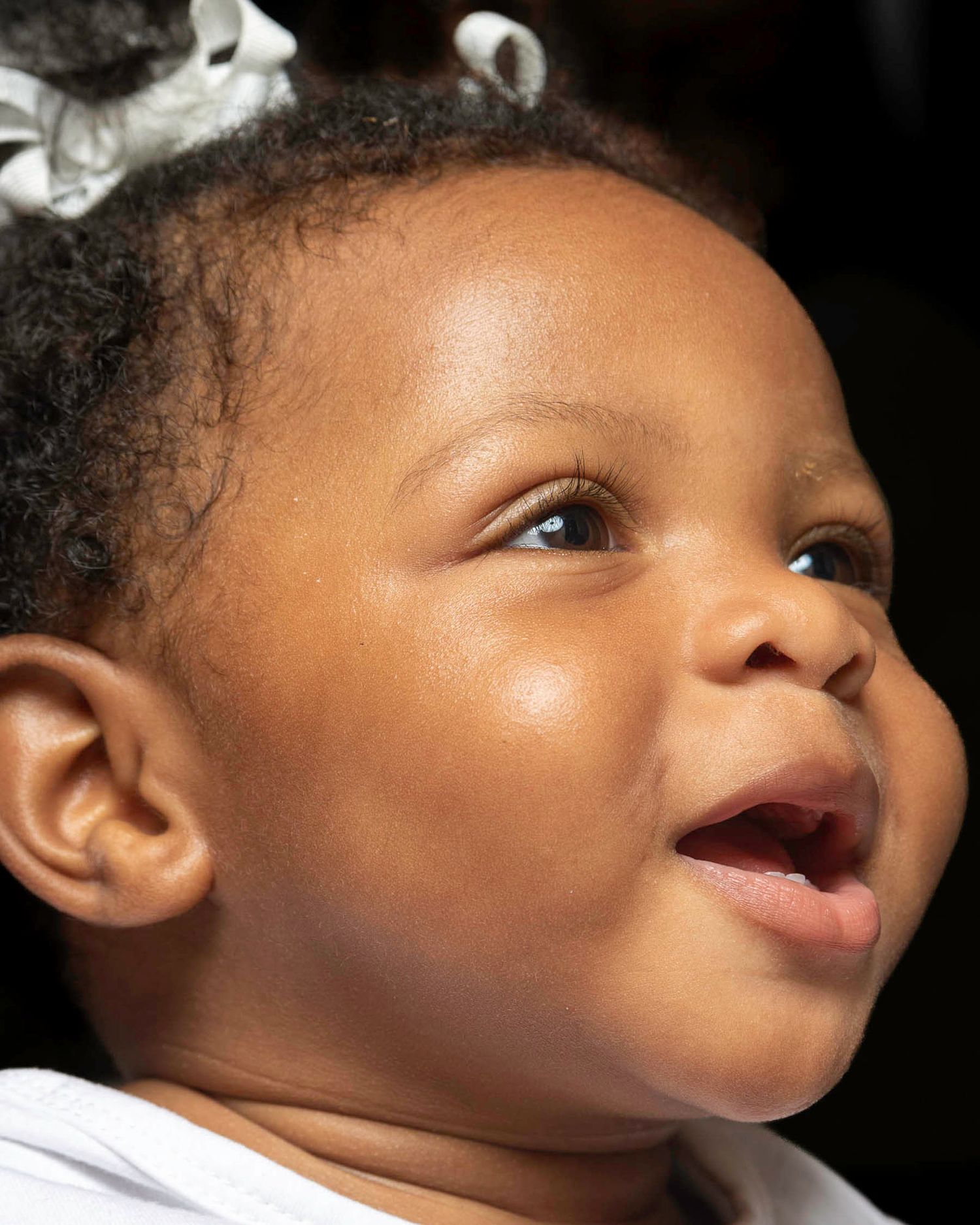 Image of toddler, black background