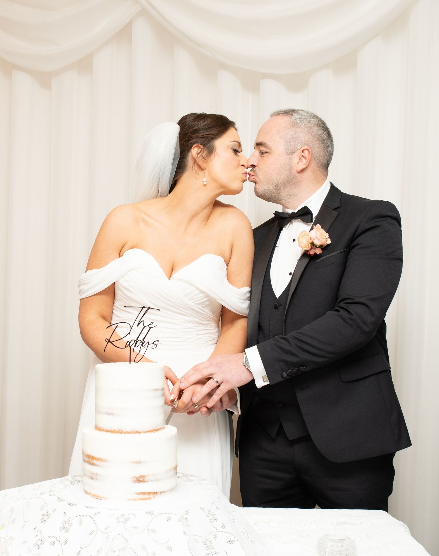 Romantic wedding portraits against a white backdrop showing tender moments.