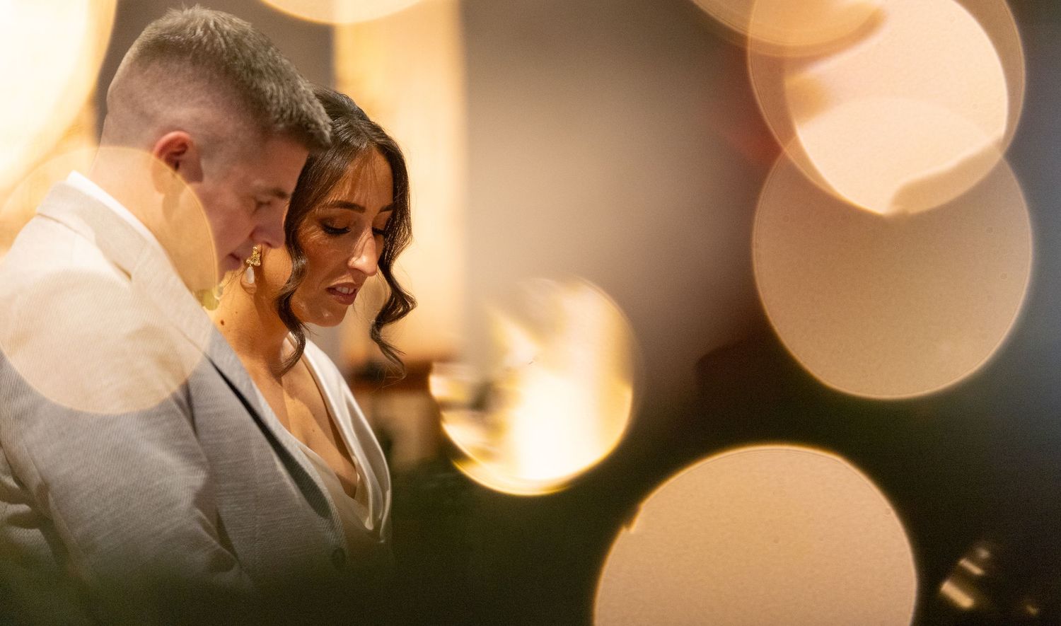 Soft focus portrait with warm bokeh lighting effects.