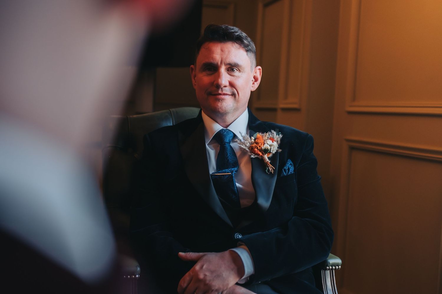 Warm-toned indoor portraits showing preparations before a formal event.