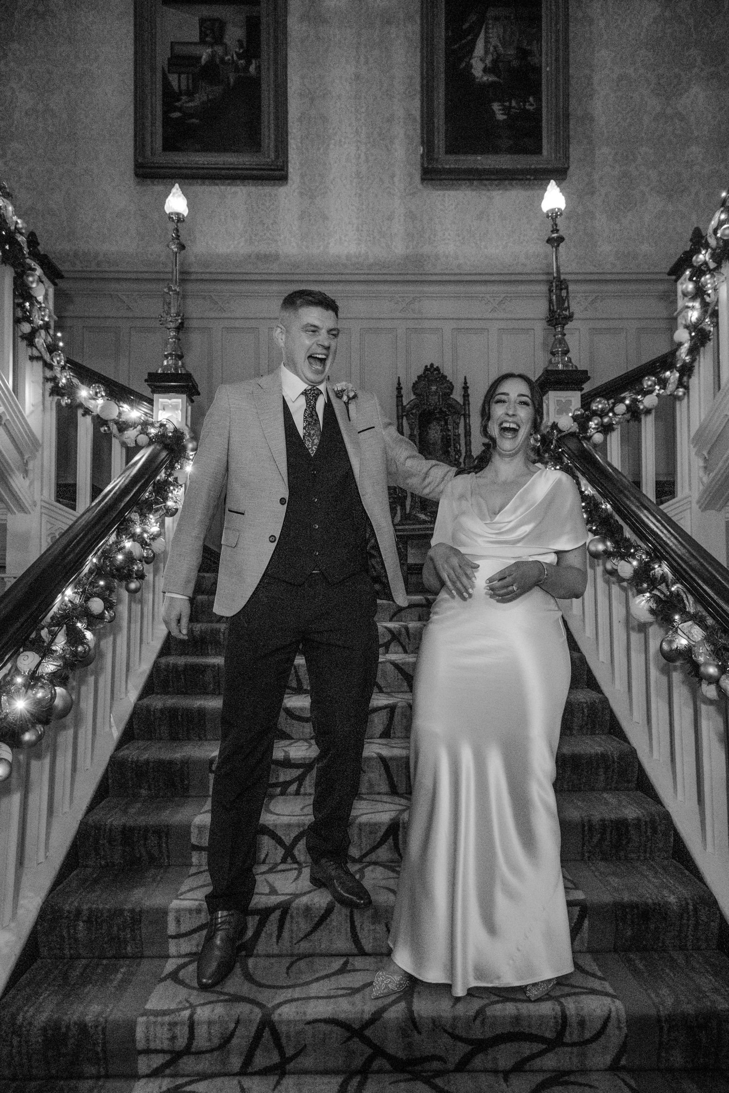 Black and white photos of couple celebrating on decorated staircase.