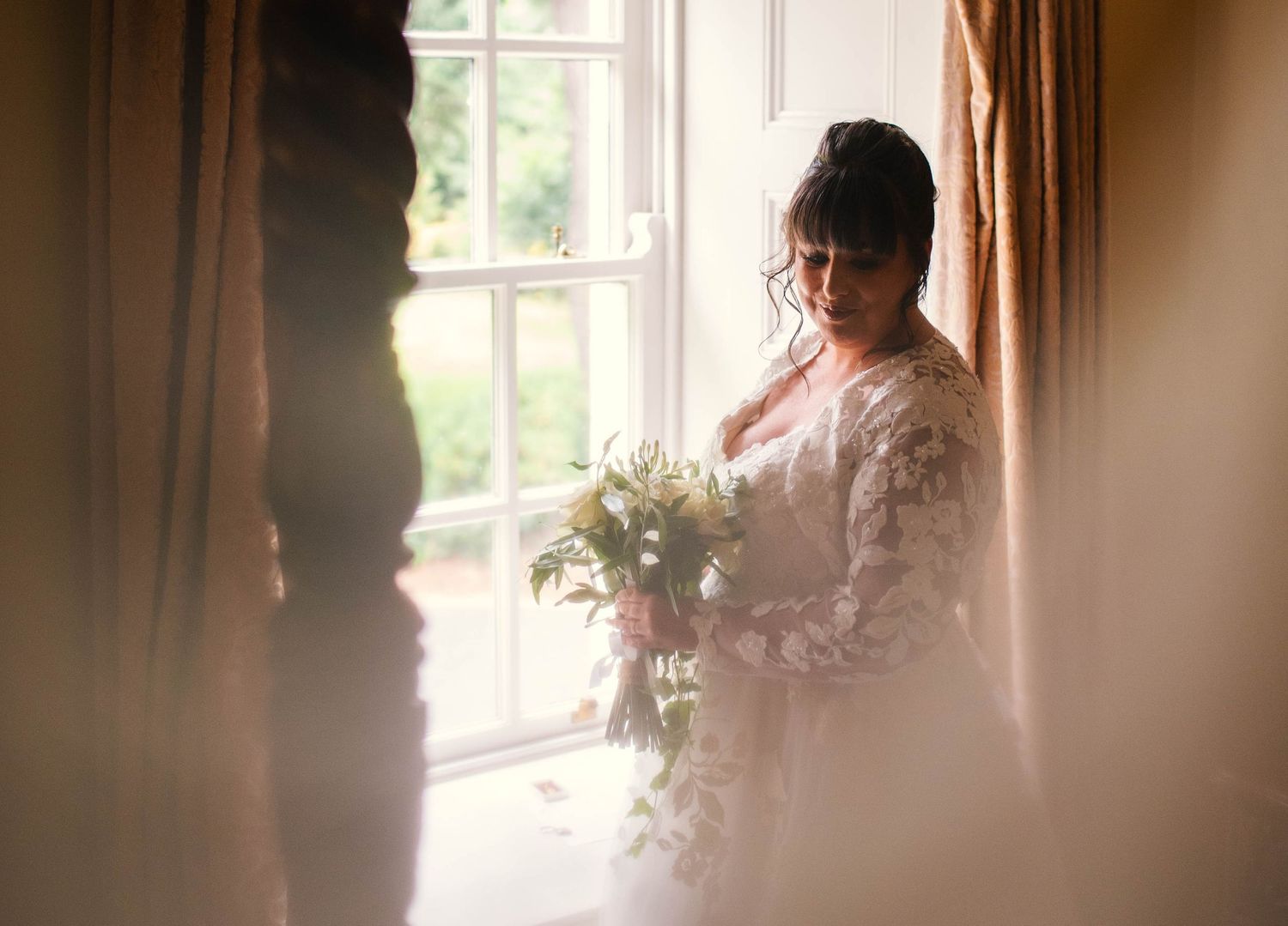 Soft window light creates a dreamy atmosphere in a series of romantic wedding day portraits.
