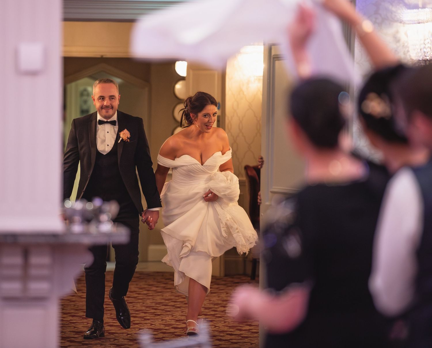 Candid moments from a wedding reception showing guests dancing and celebrating.