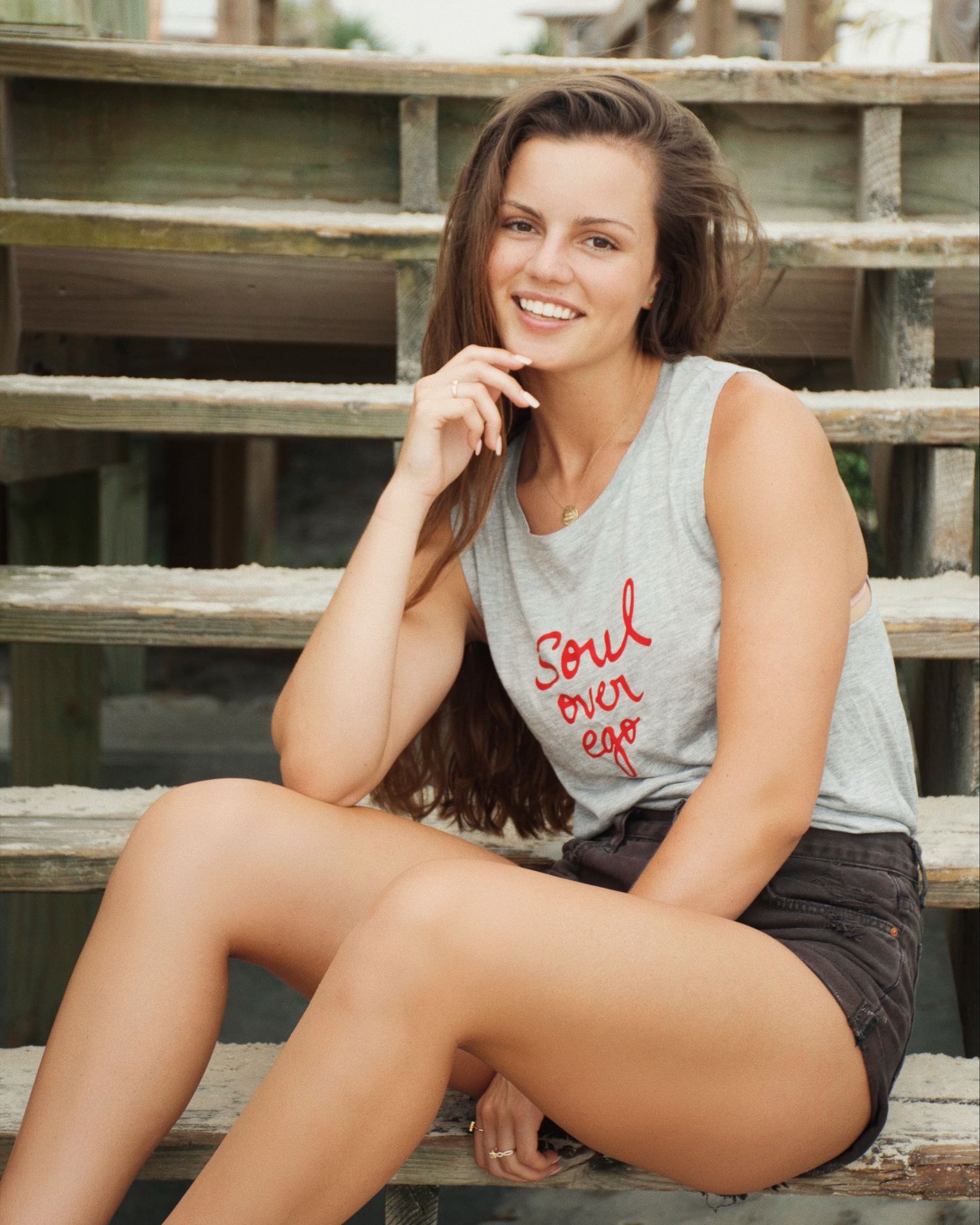 Casual lifestyle photography session on wooden steps outdoors.
