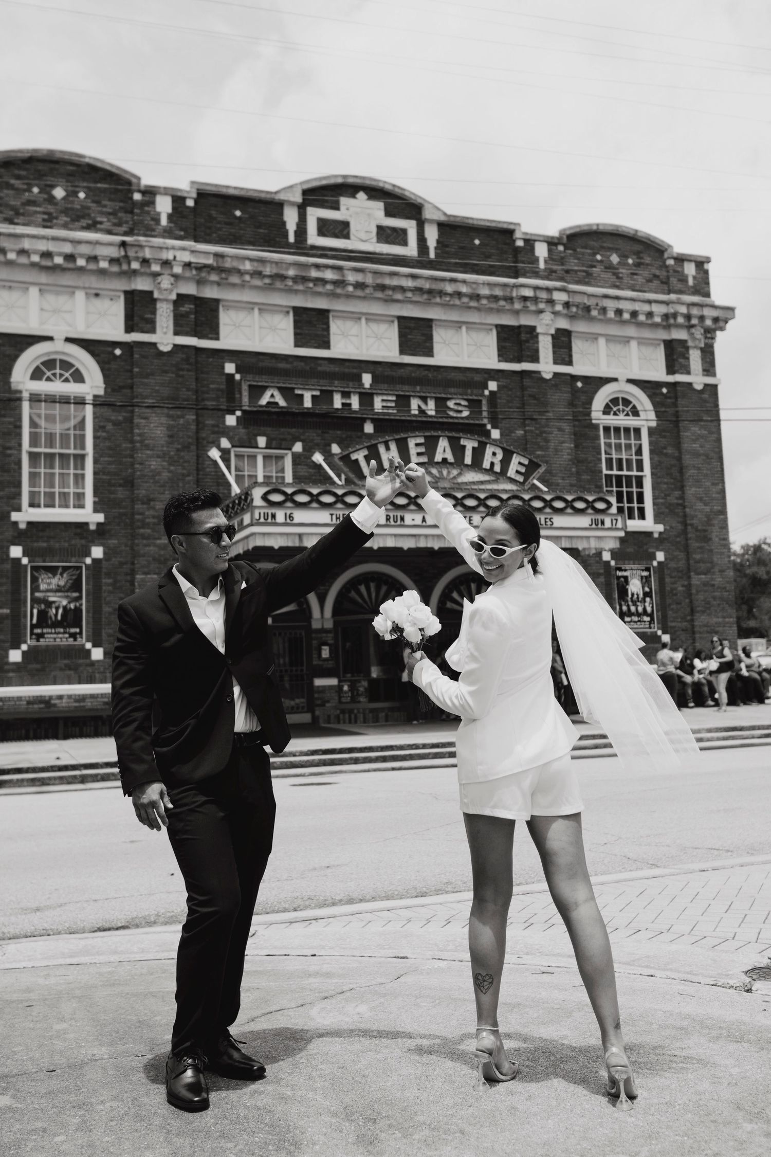 Vintage black and white photos showing a playful scene outside Athens Theatre with dramatic lighting and poses.