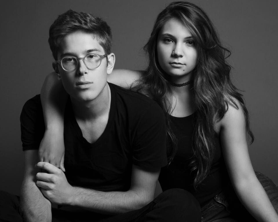 Black and white studio portraits showing dramatic lighting and moody expressions.