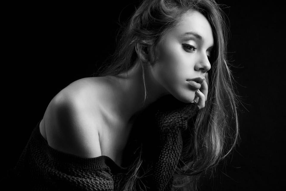 Artistic black and white portraits with dramatic shadows and textures.