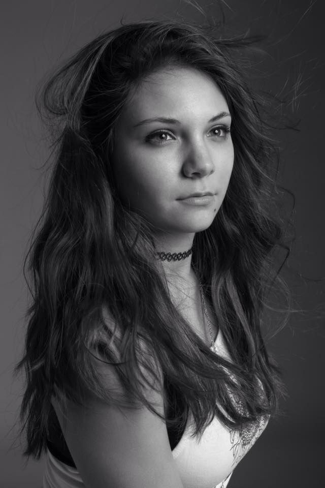 Black and white portrait series showing dynamic hair movement and dramatic lighting.