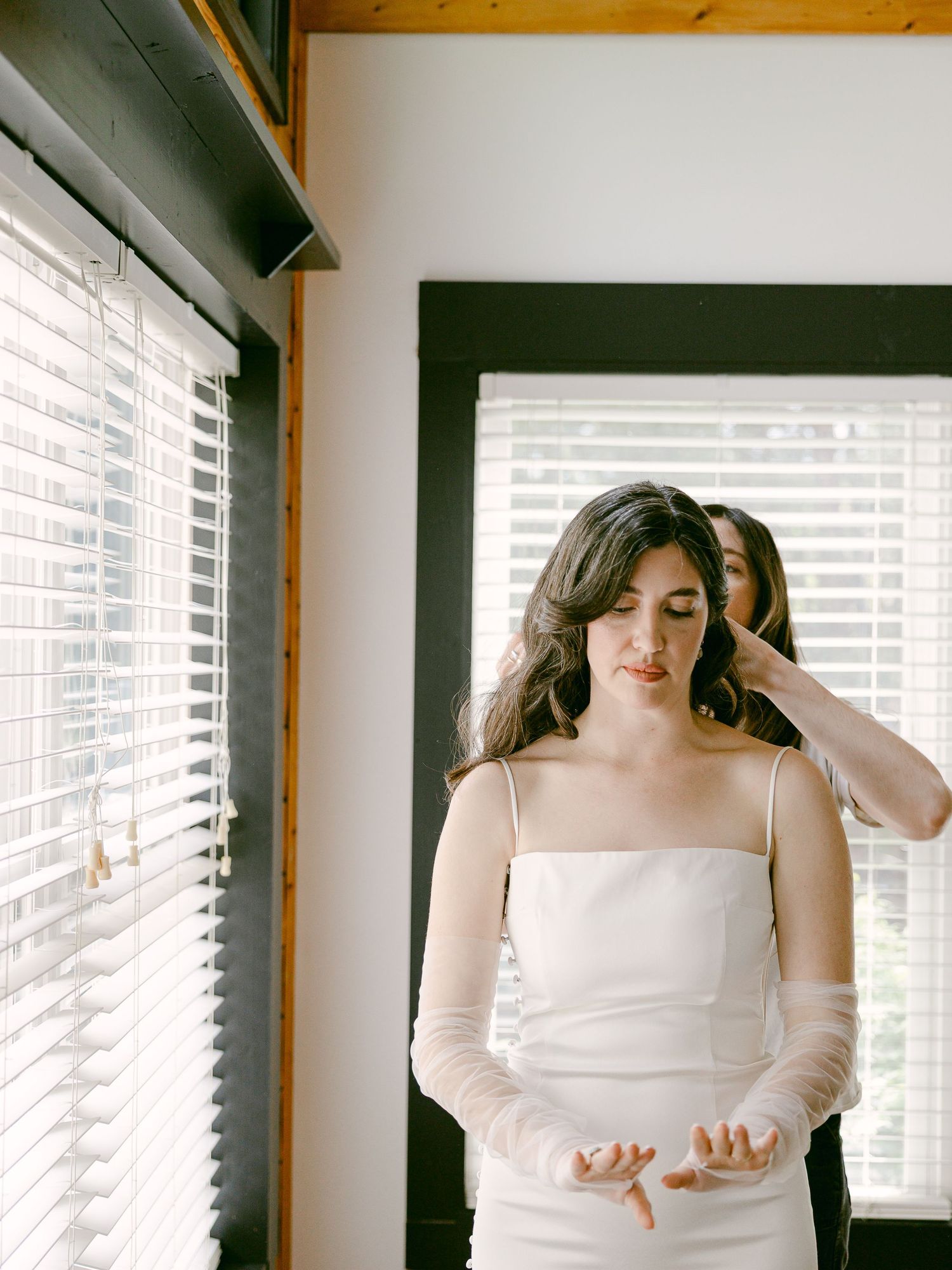 Intimate wedding and elopement in Asheville, North Carolina, capturing candid and authentic moments while the bride got ready in an Airbnb