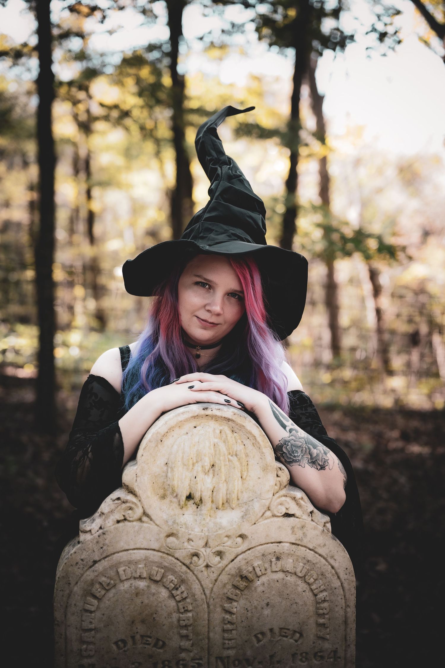 A witch-themed photo series shows someone in a black hat posing with an old weathered gravestone in a forest setting.