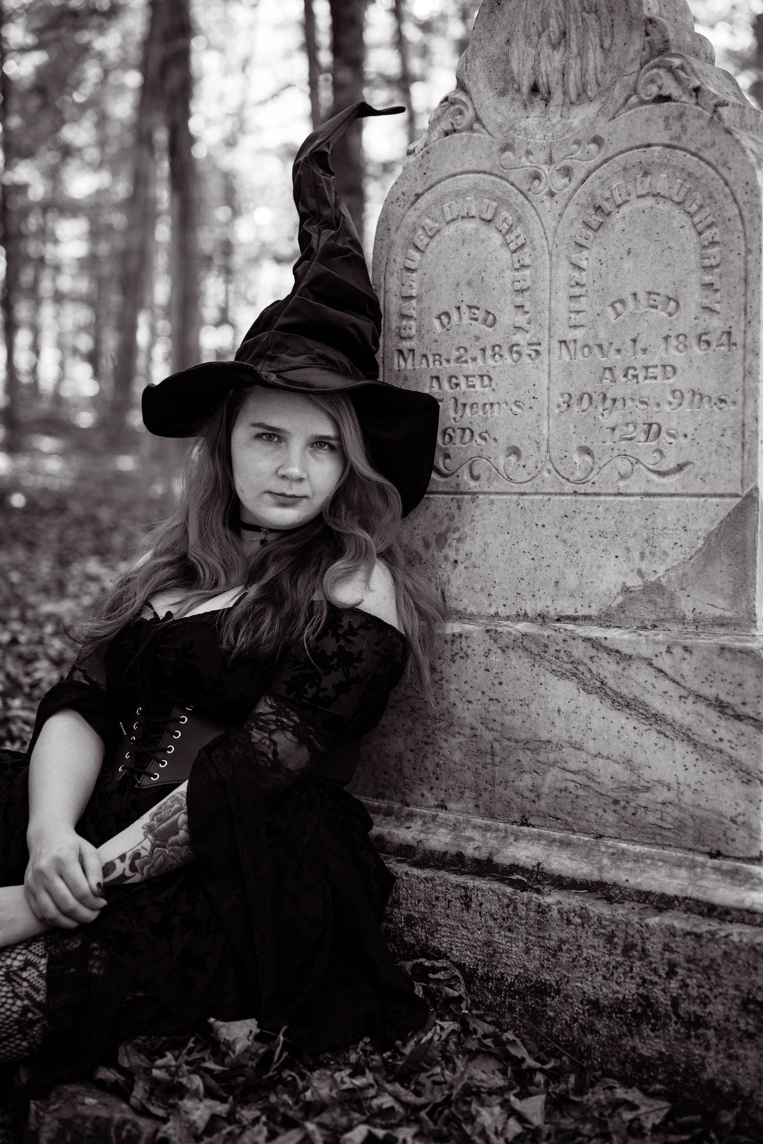 A series of black and white photos showing someone in a witch costume posing near old gravestones in a cemetery.